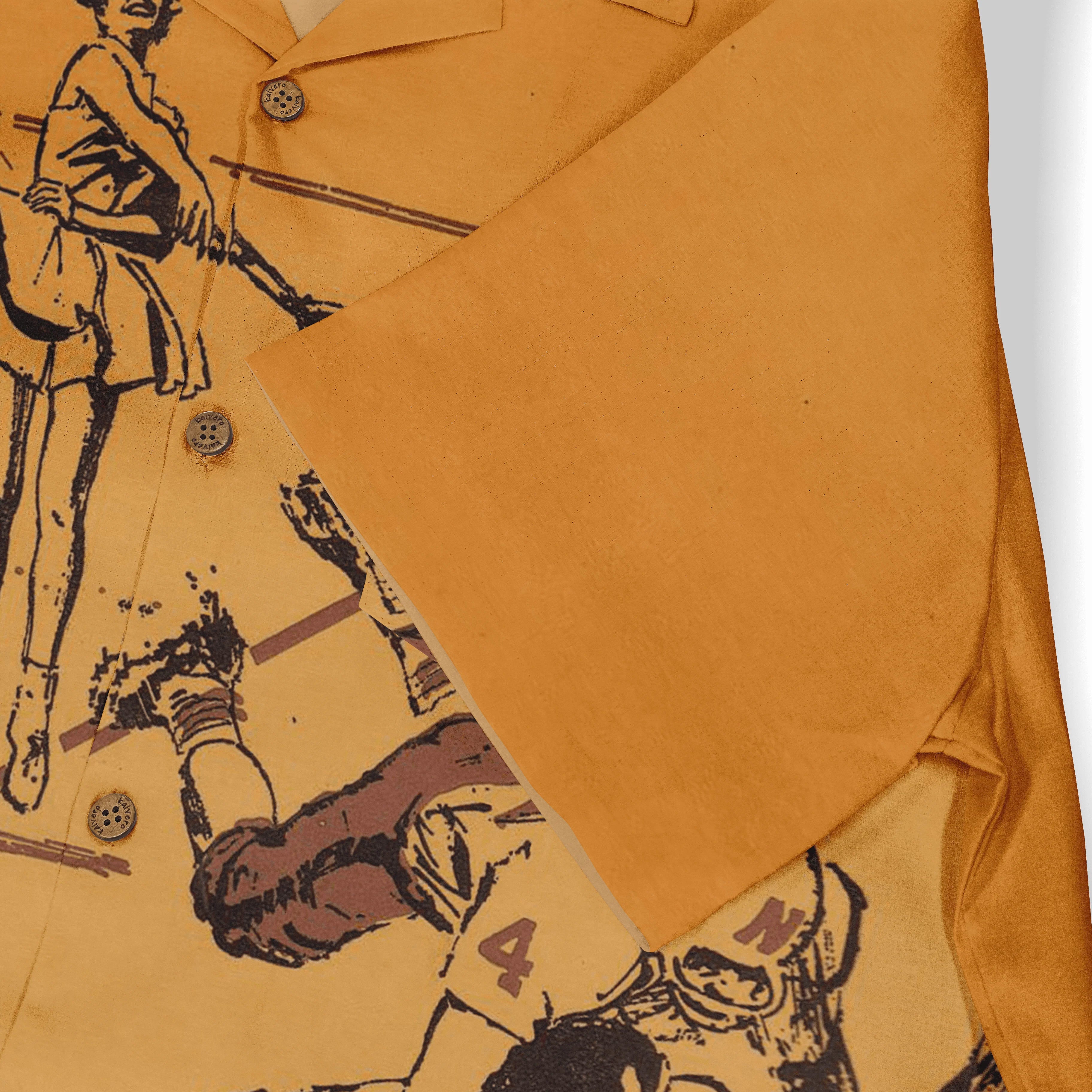 Mustard yellow shirt with graphic print of vintage-style figures.