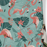 Tropical flamingo print shirt with vibrant pink birds, green leaves.