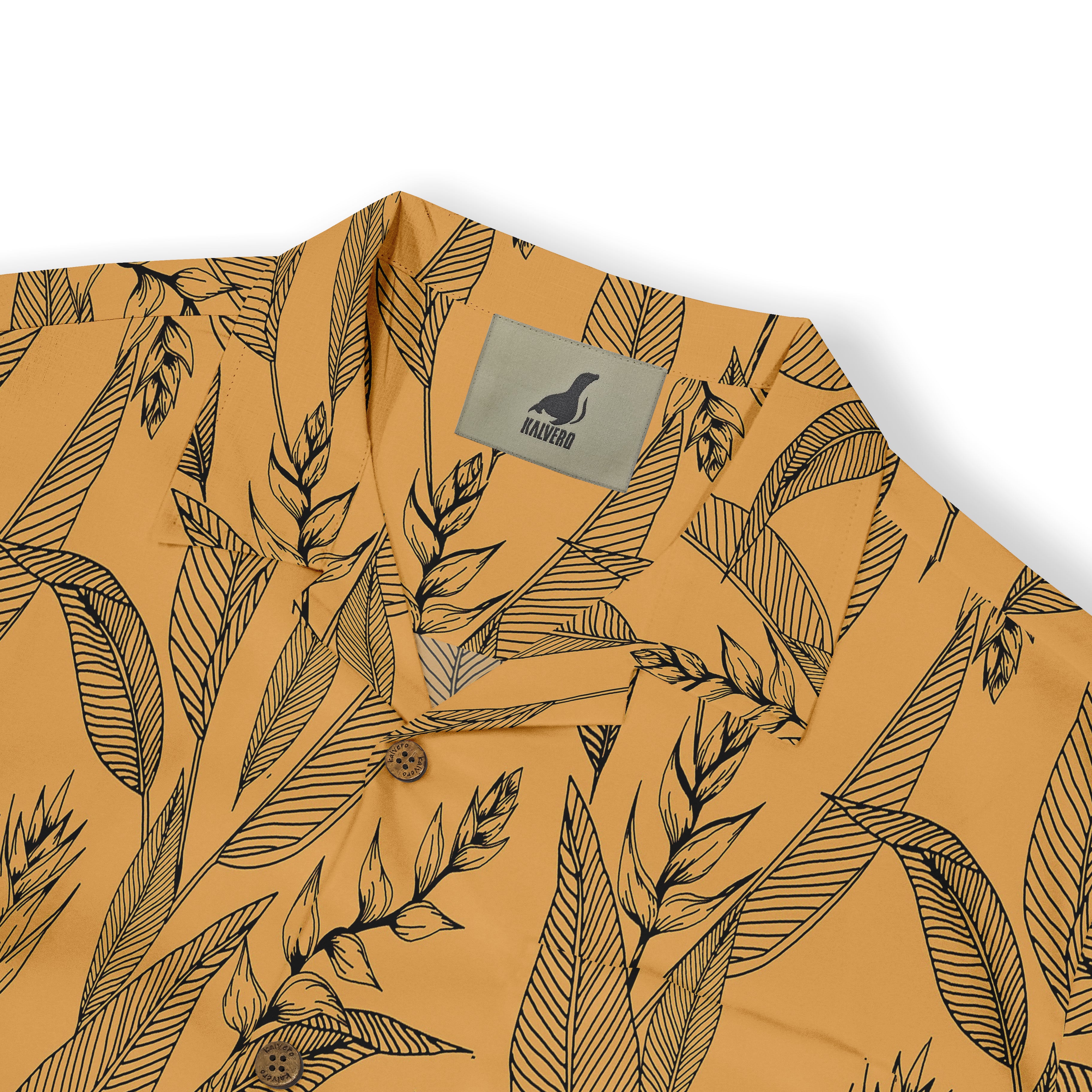 Mustard yellow shirt with black leaf pattern, featuring a brand tag.