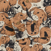 Halloween-themed fabric with pumpkins, bats, and ghosts in orange.