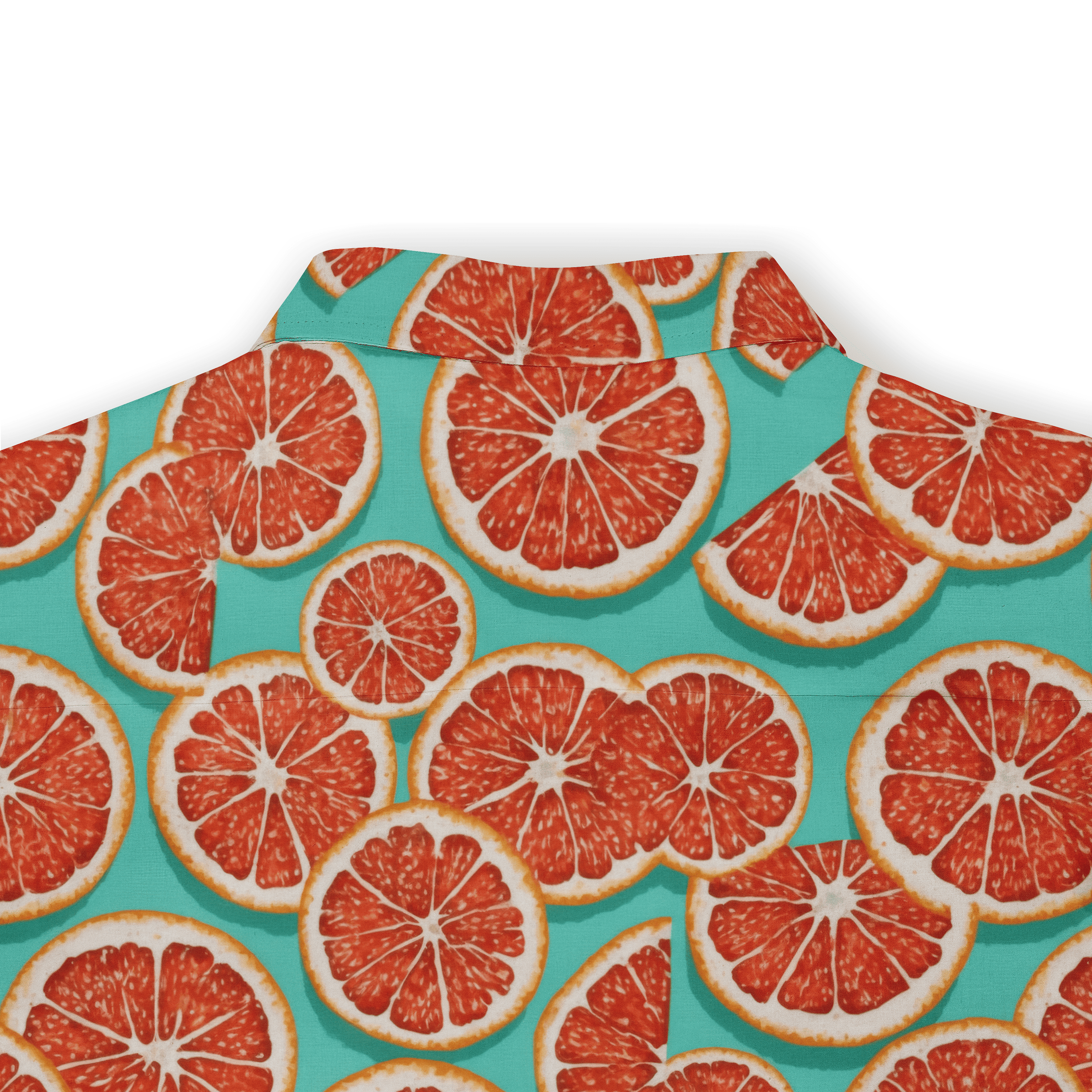 Vibrant citrus print shirt with sliced grapefruits on a teal.