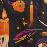 Black fabric with Halloween-themed print featuring candles, stars.