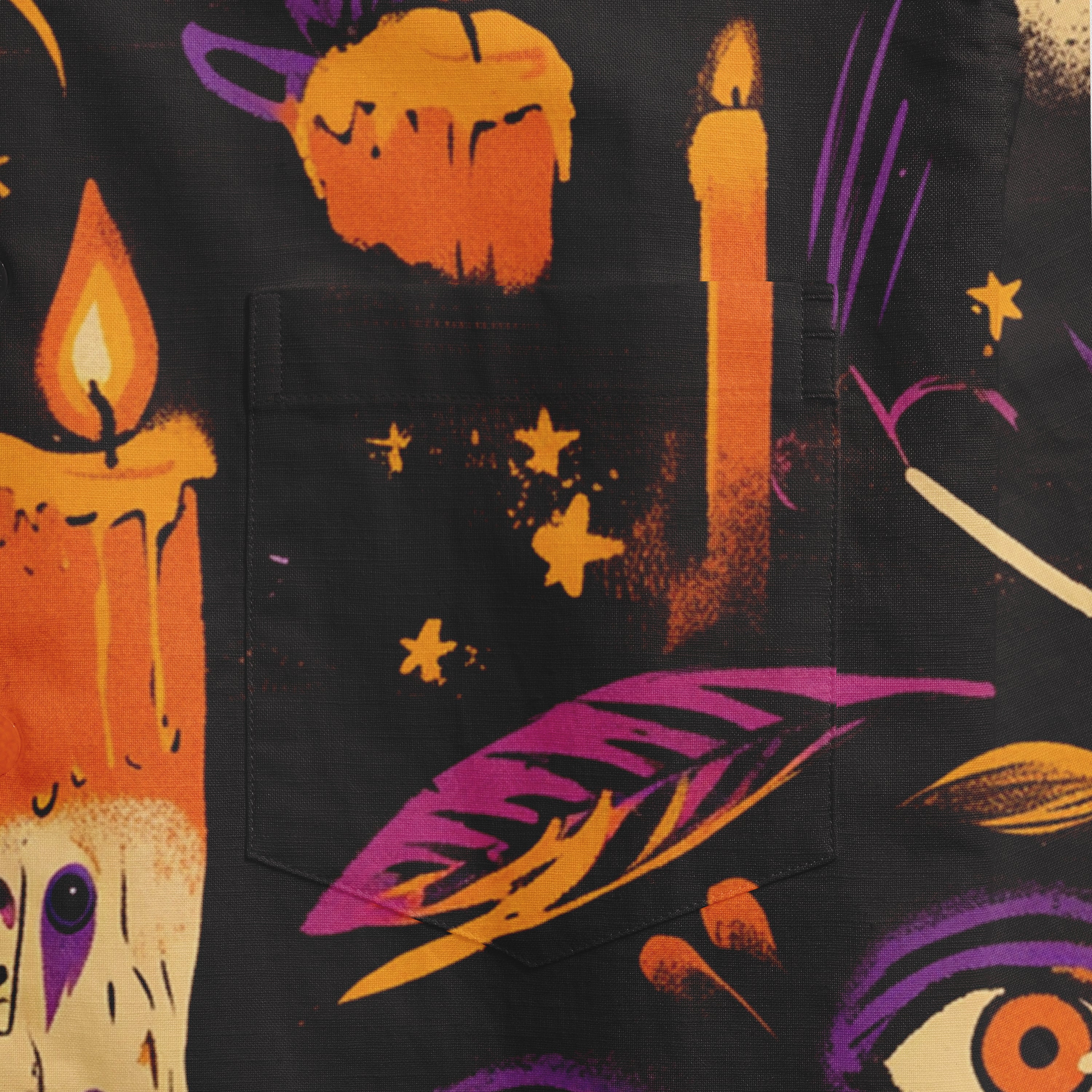 Black fabric with Halloween-themed print featuring candles, stars.