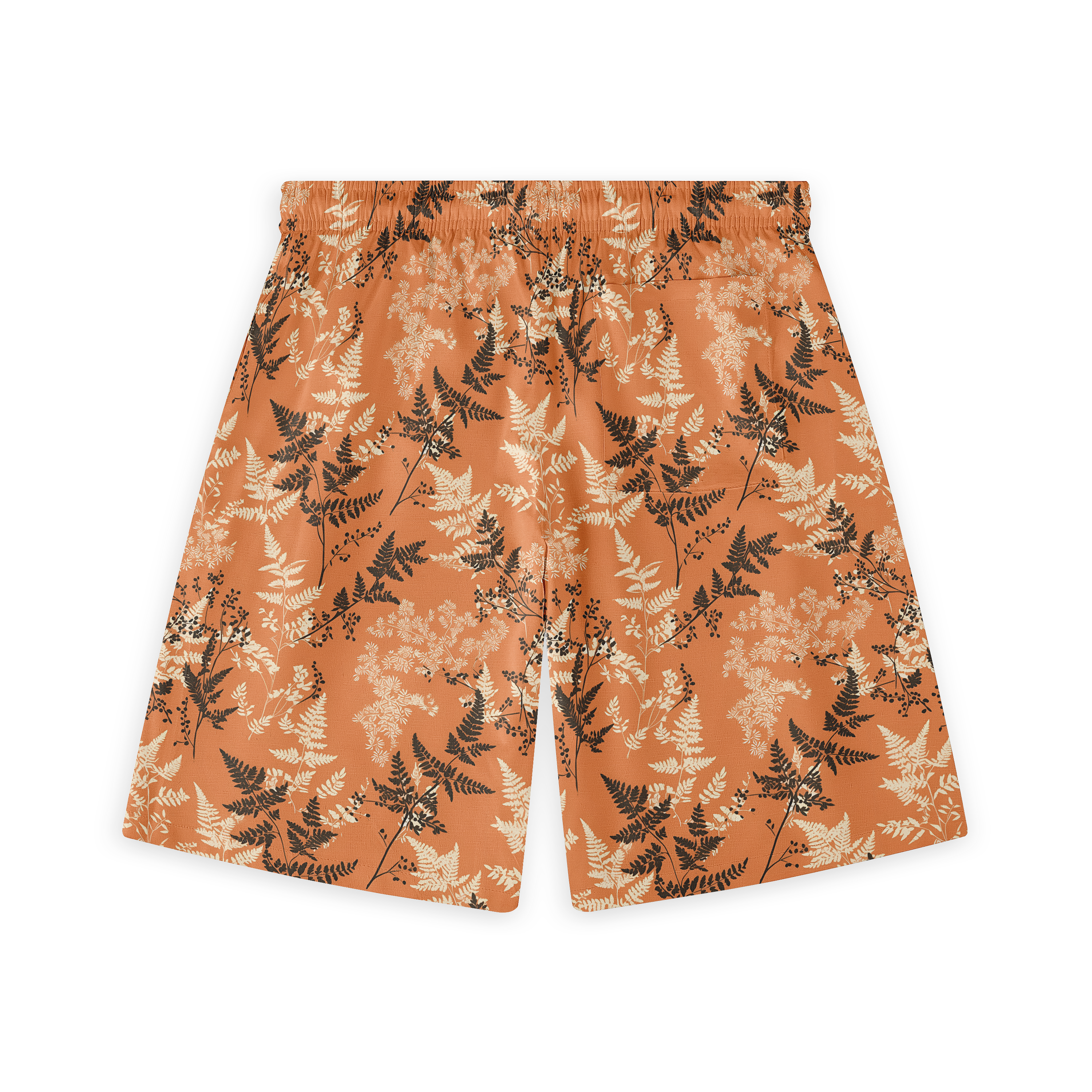 Orange shorts with black and white fern patterns.