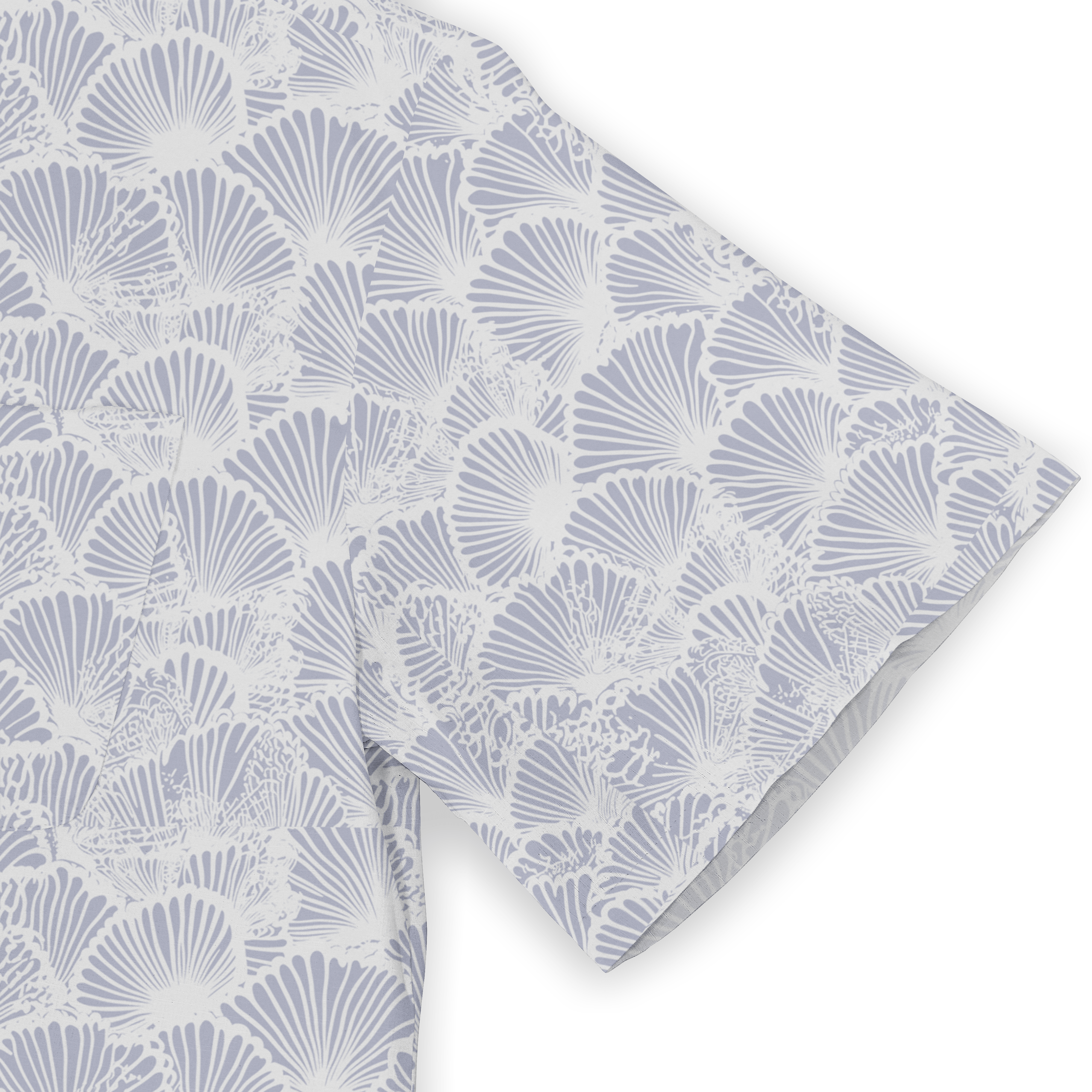 Light blue and white fabric with a repeating shell pattern, folded.