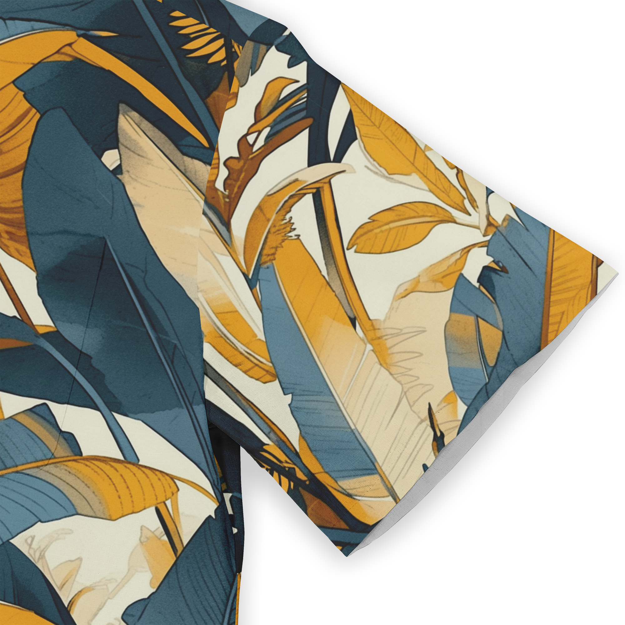 Tropical leaf patterned fabric in navy, mustard, and cream, folded.