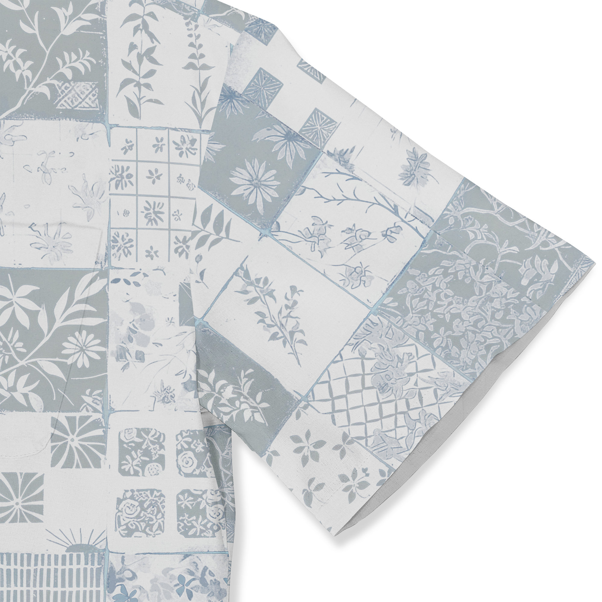 Blue and white patterned fabric with floral and geometric designs.