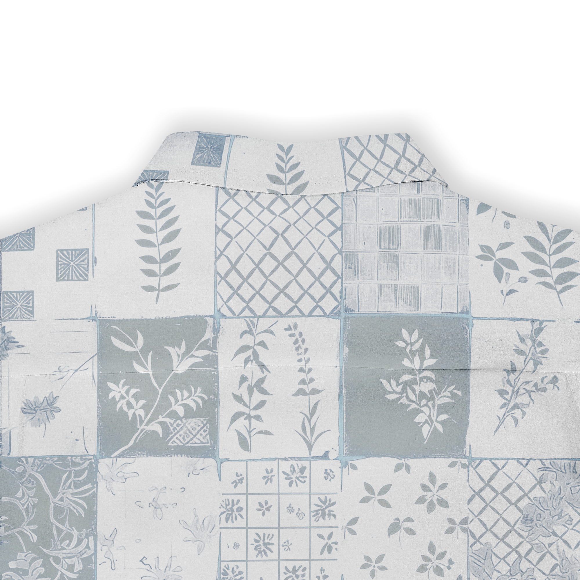 Patchwork shirt with blue and white botanical and geometric patterns.