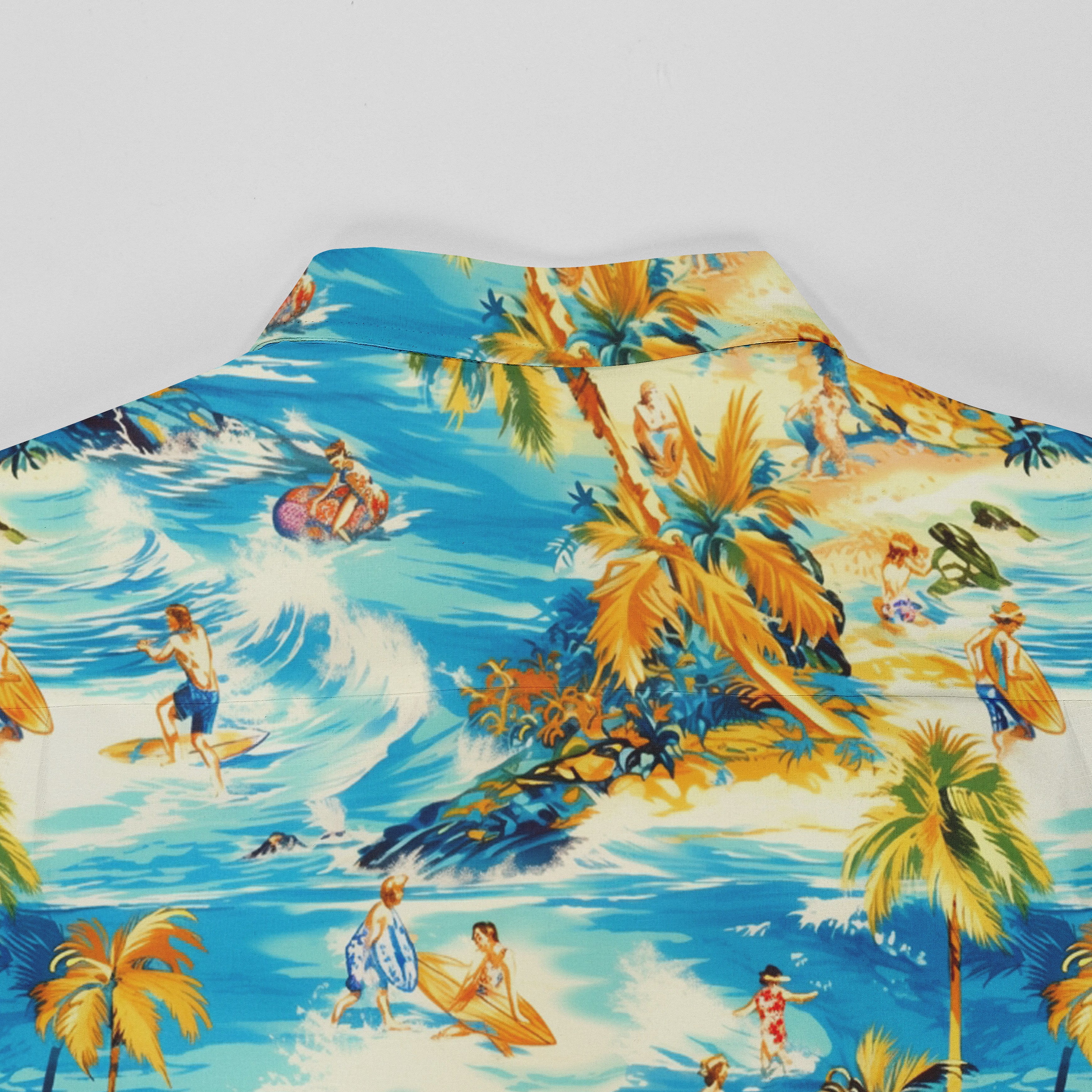 Tropical beach scene shirt with palm trees, surfers, and swimmers.