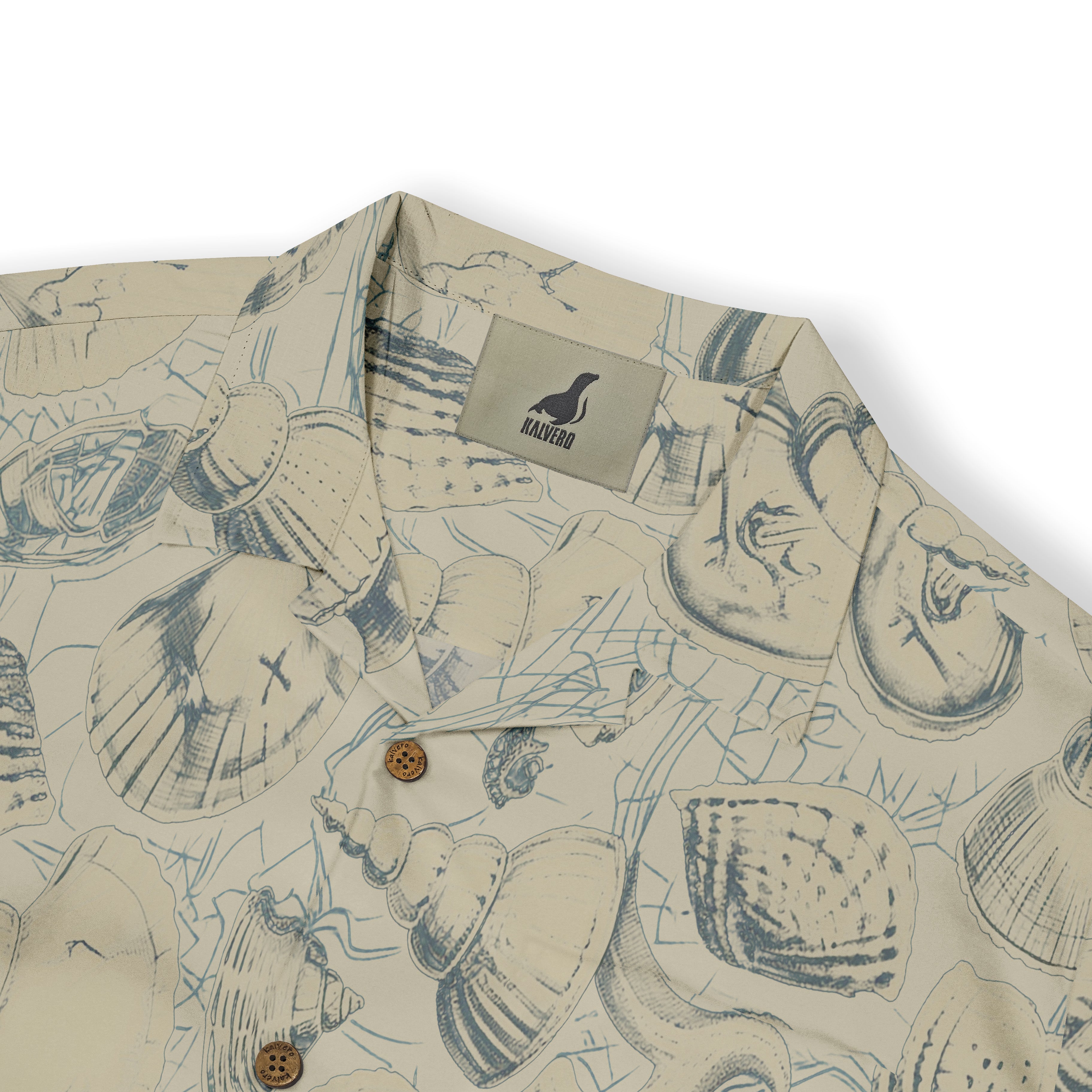 Beige shirt with blue seashell print, wooden buttons, and Halvoro.