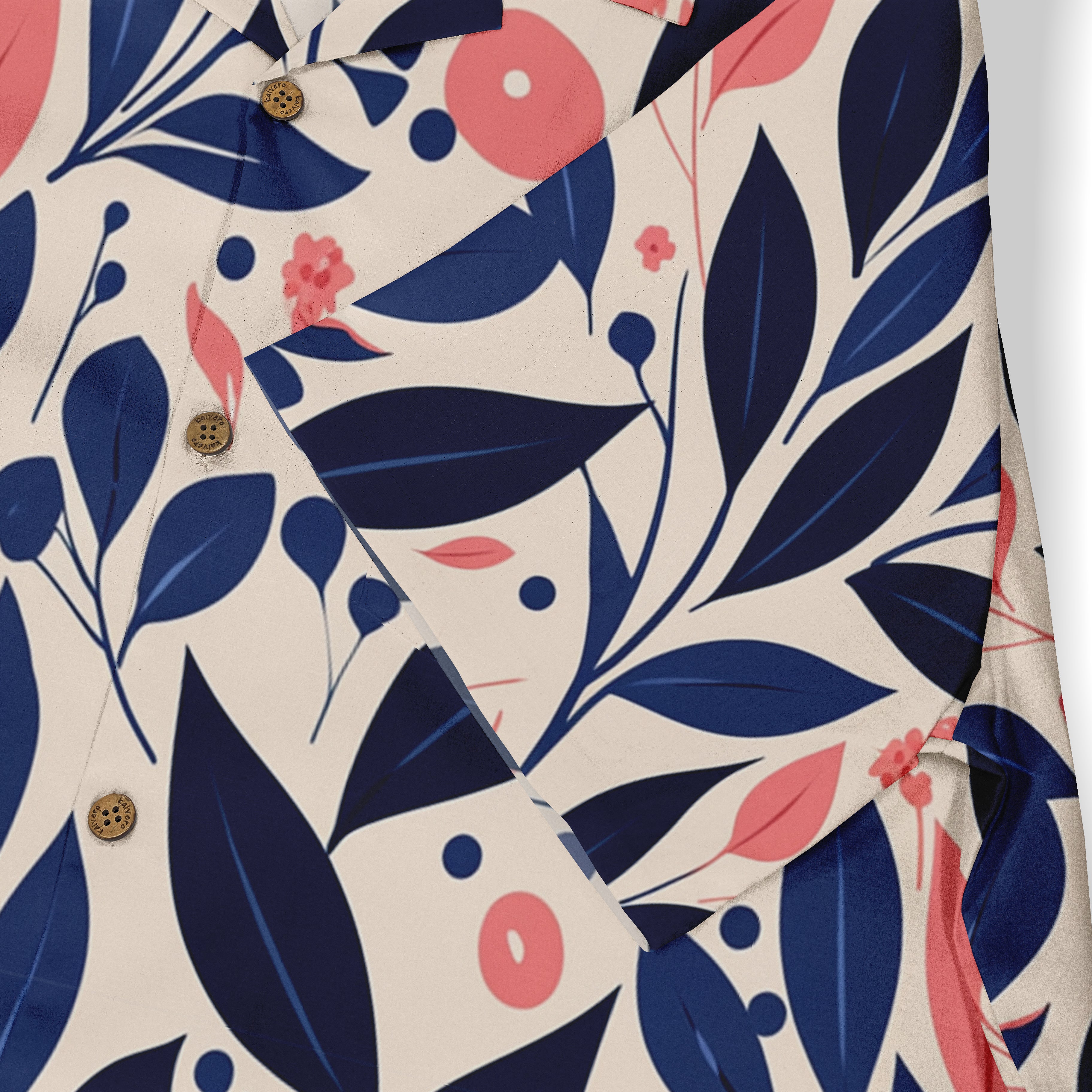 Floral patterned shirt with navy blue leaves, pink flowers.