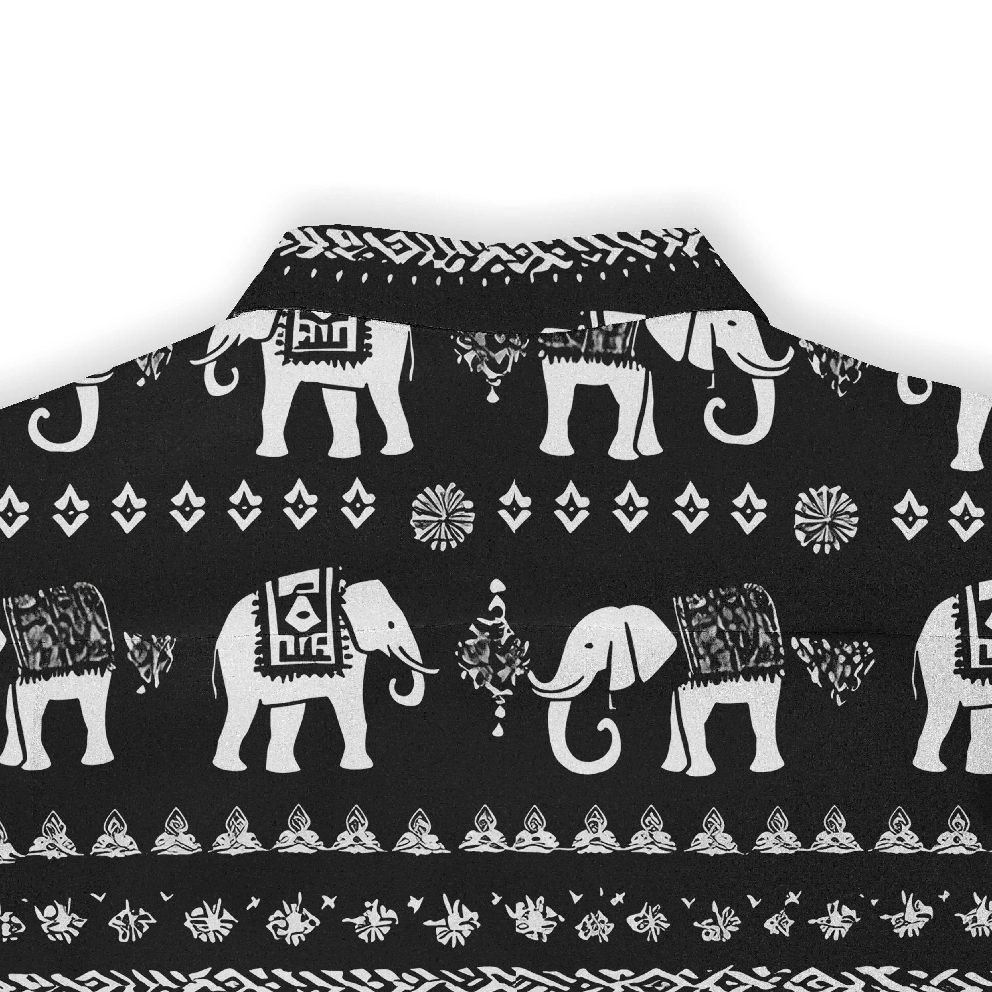 Black fabric with white elephant and geometric patterns.