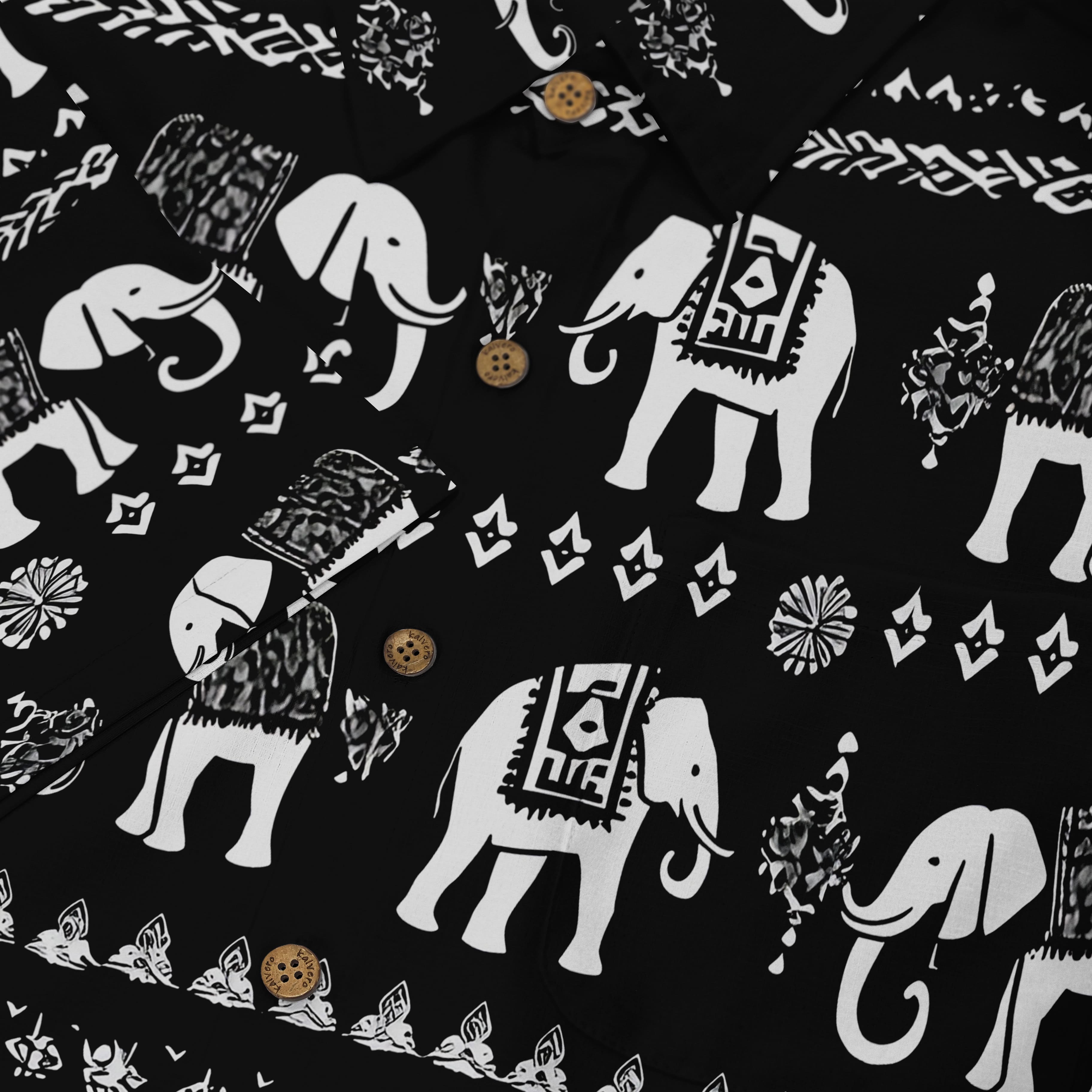 Black shirt with white elephant patterns and decorative elements.
