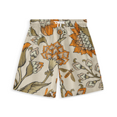 Beige shorts with orange and brown floral pattern.