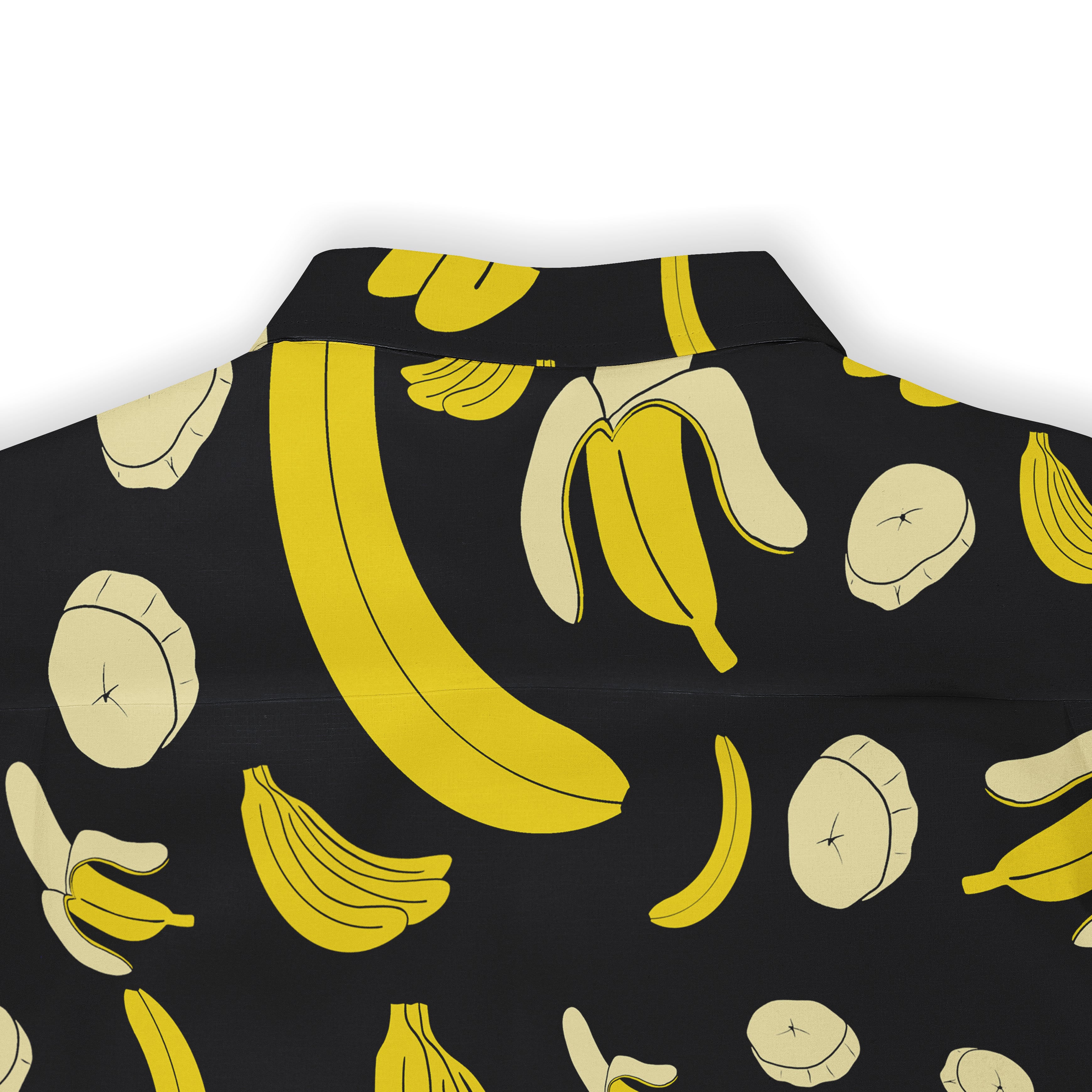 Black shirt with yellow banana print, featuring whole and sliced.