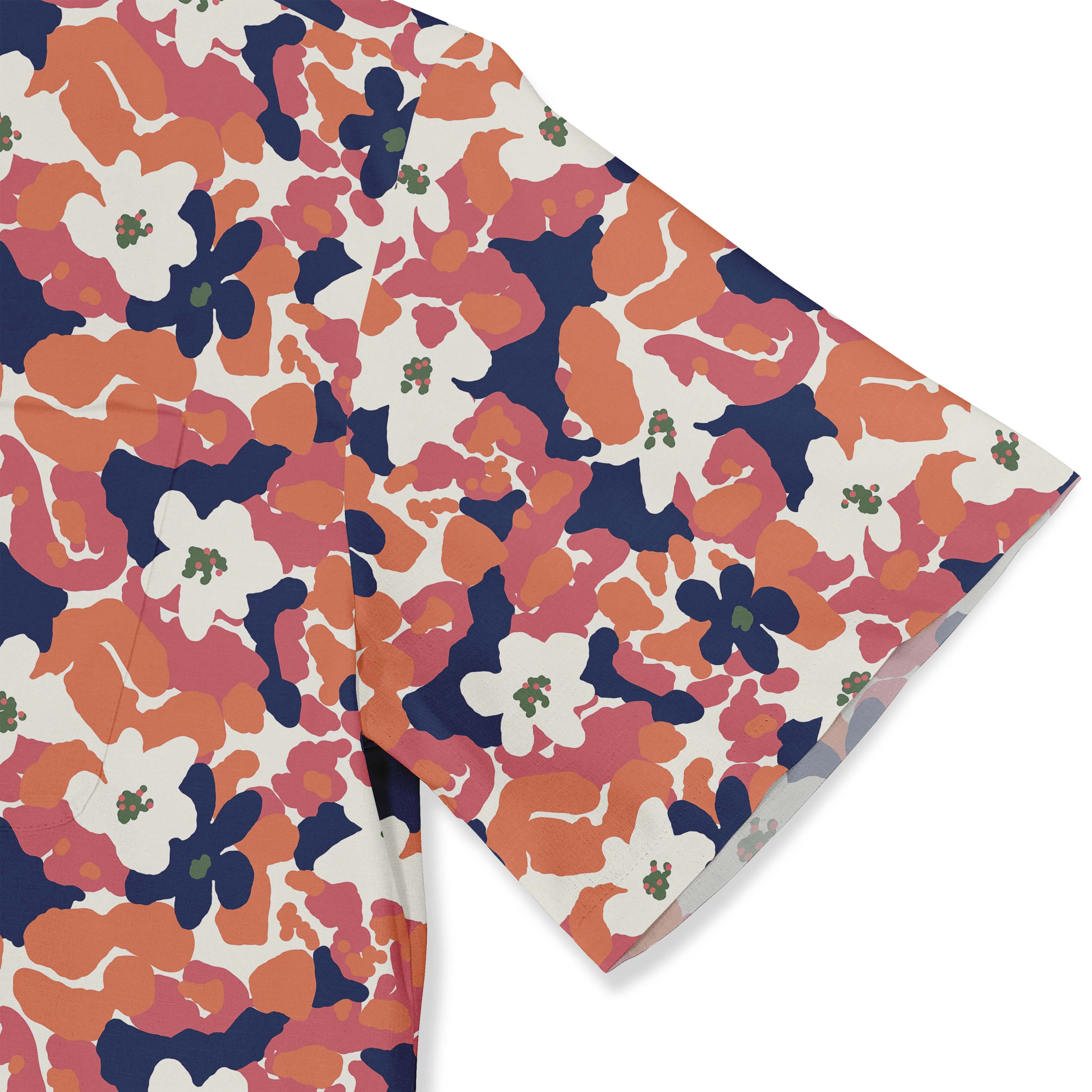 Floral camo print fabric, orange, pink, navy on white background.