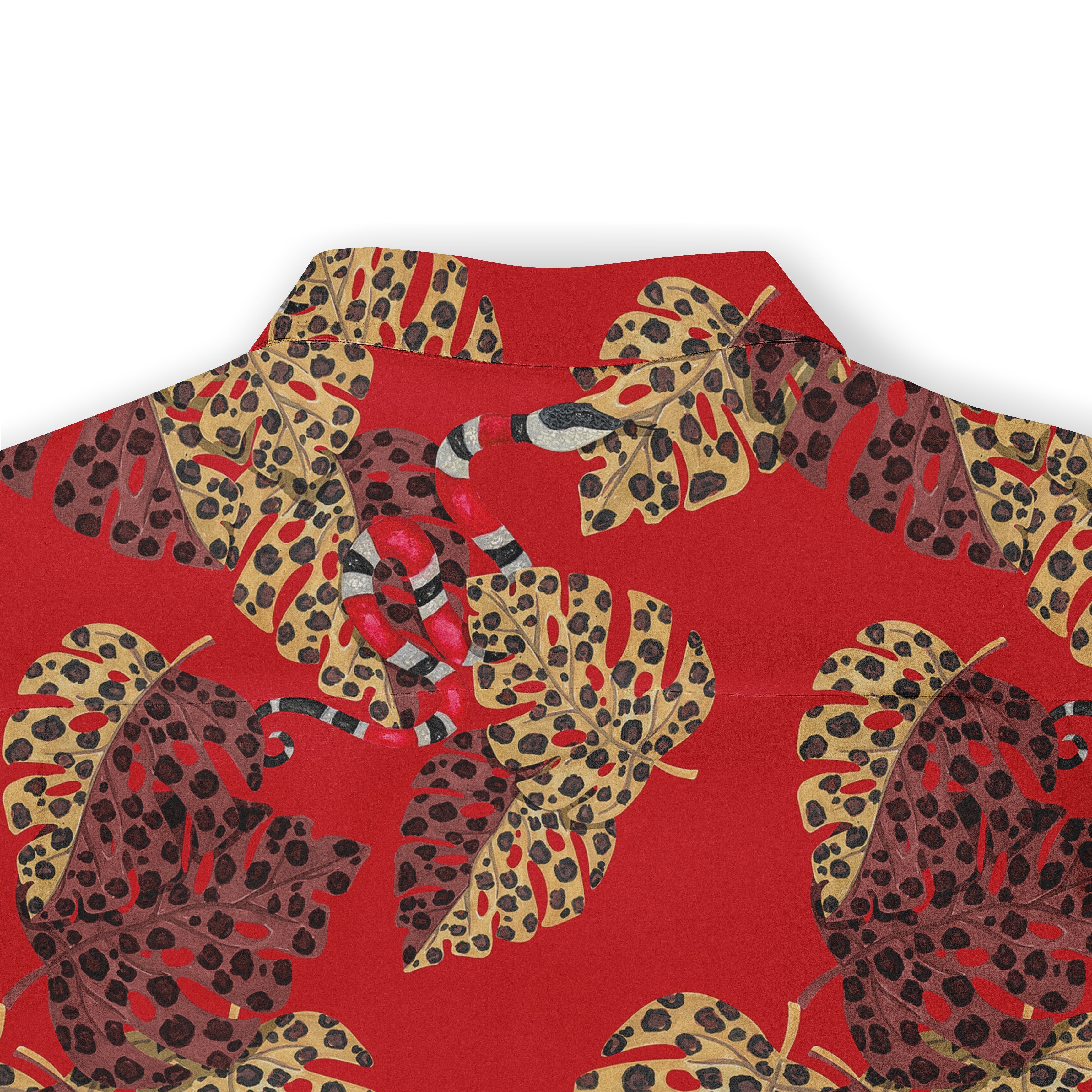 Red shirt with tropical leaf and snake print pattern.