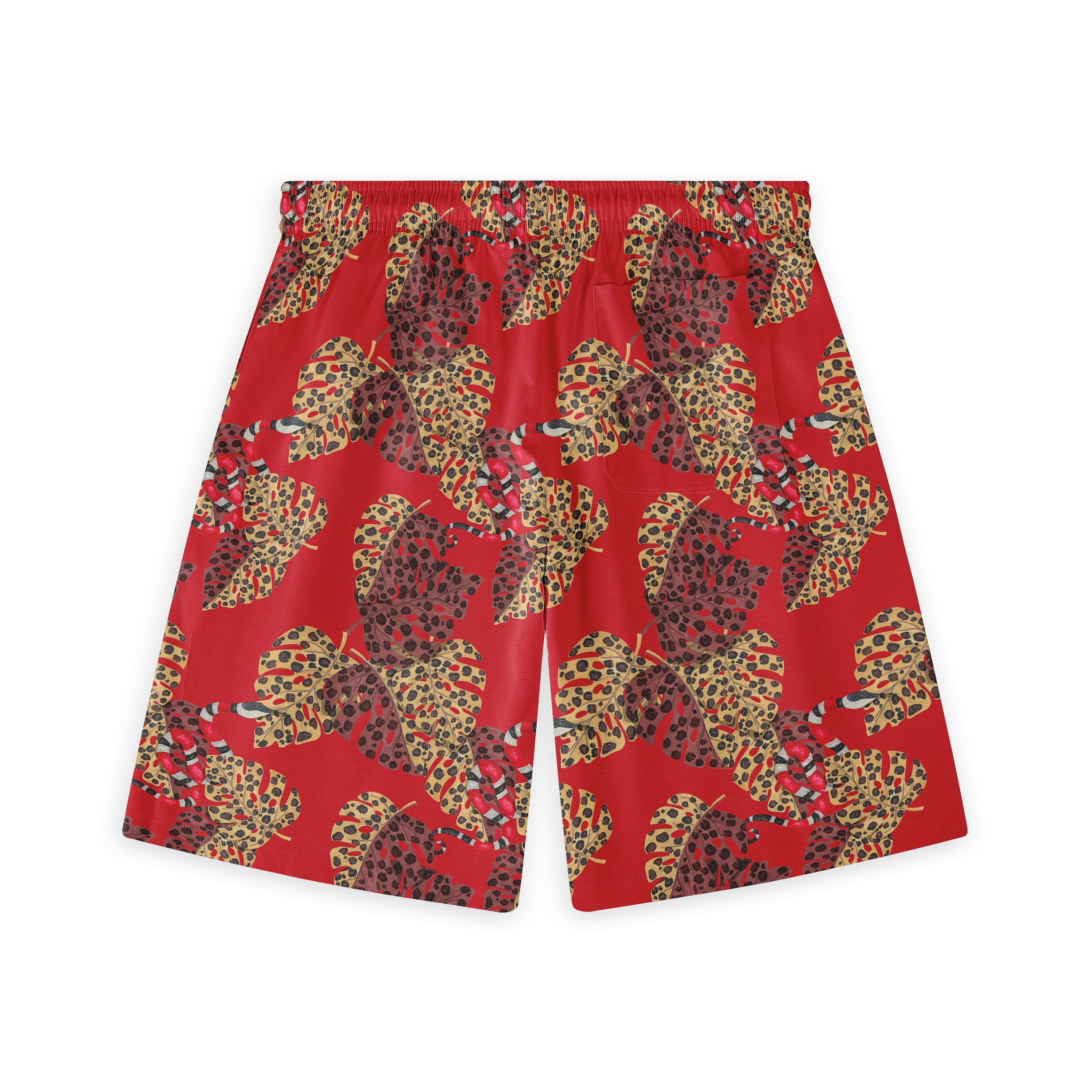 Red shorts with a vibrant tropical leaf pattern featuring leopard.