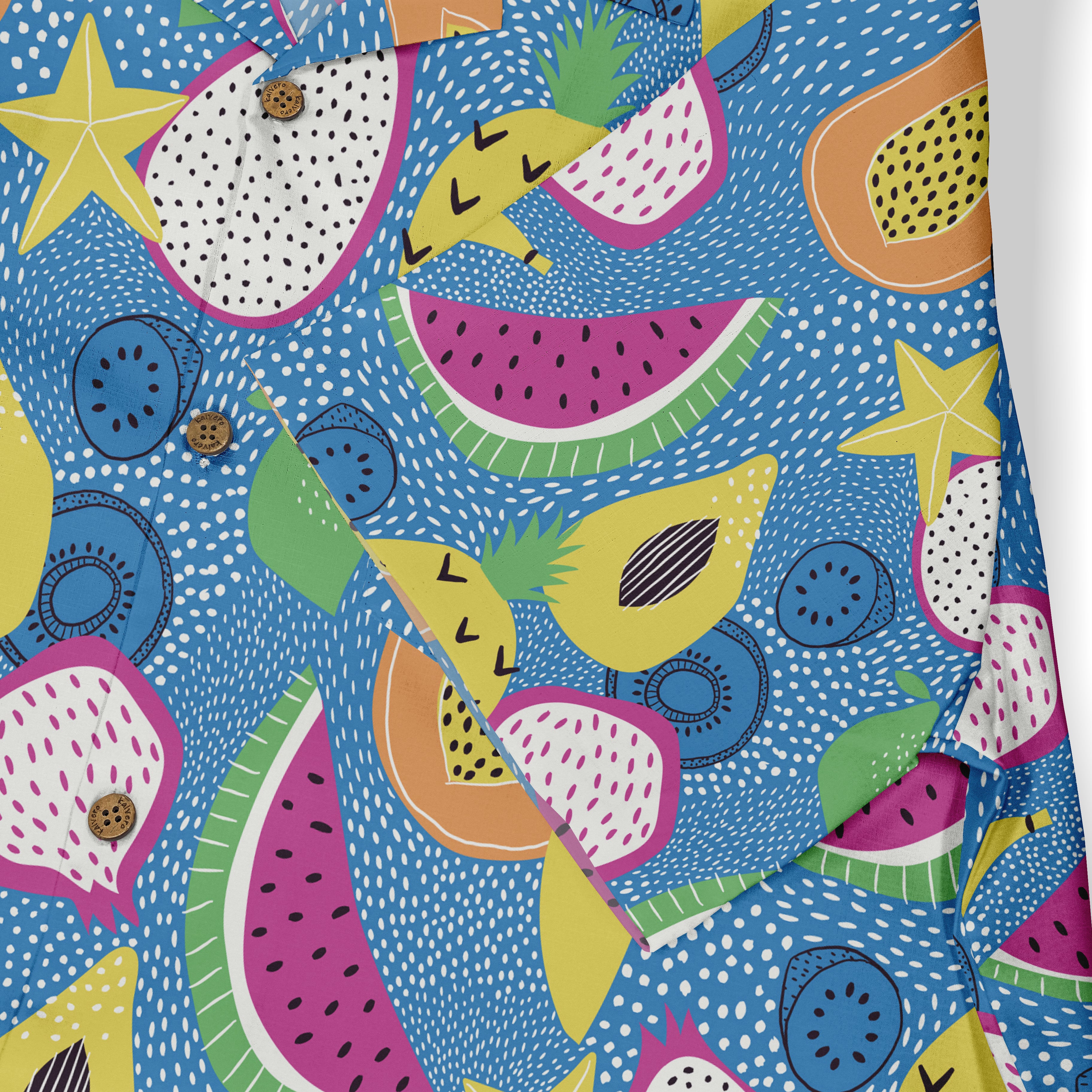 Colorful tropical fruit pattern on blue fabric with buttons.