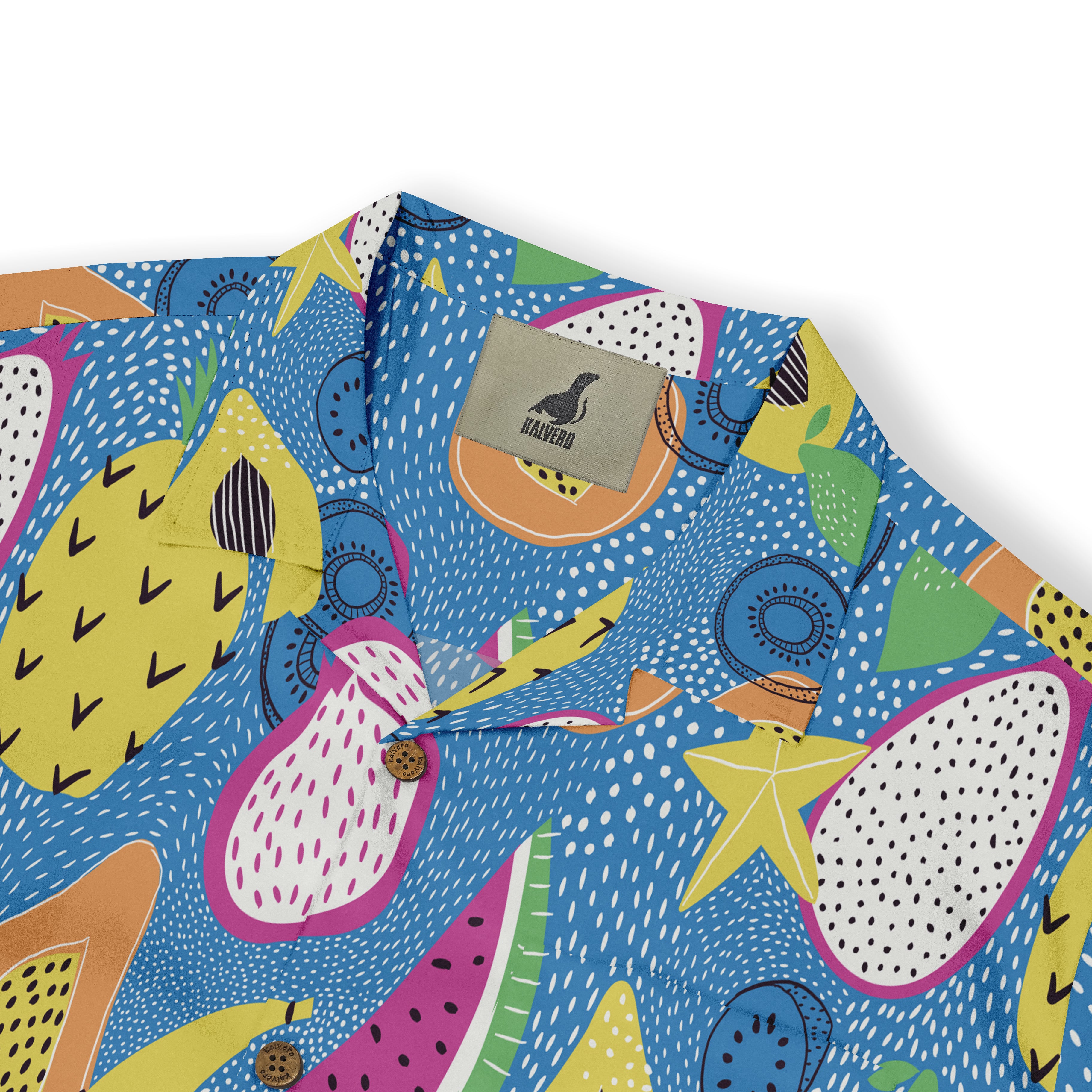 Colorful tropical fruit pattern shirt with blue background.