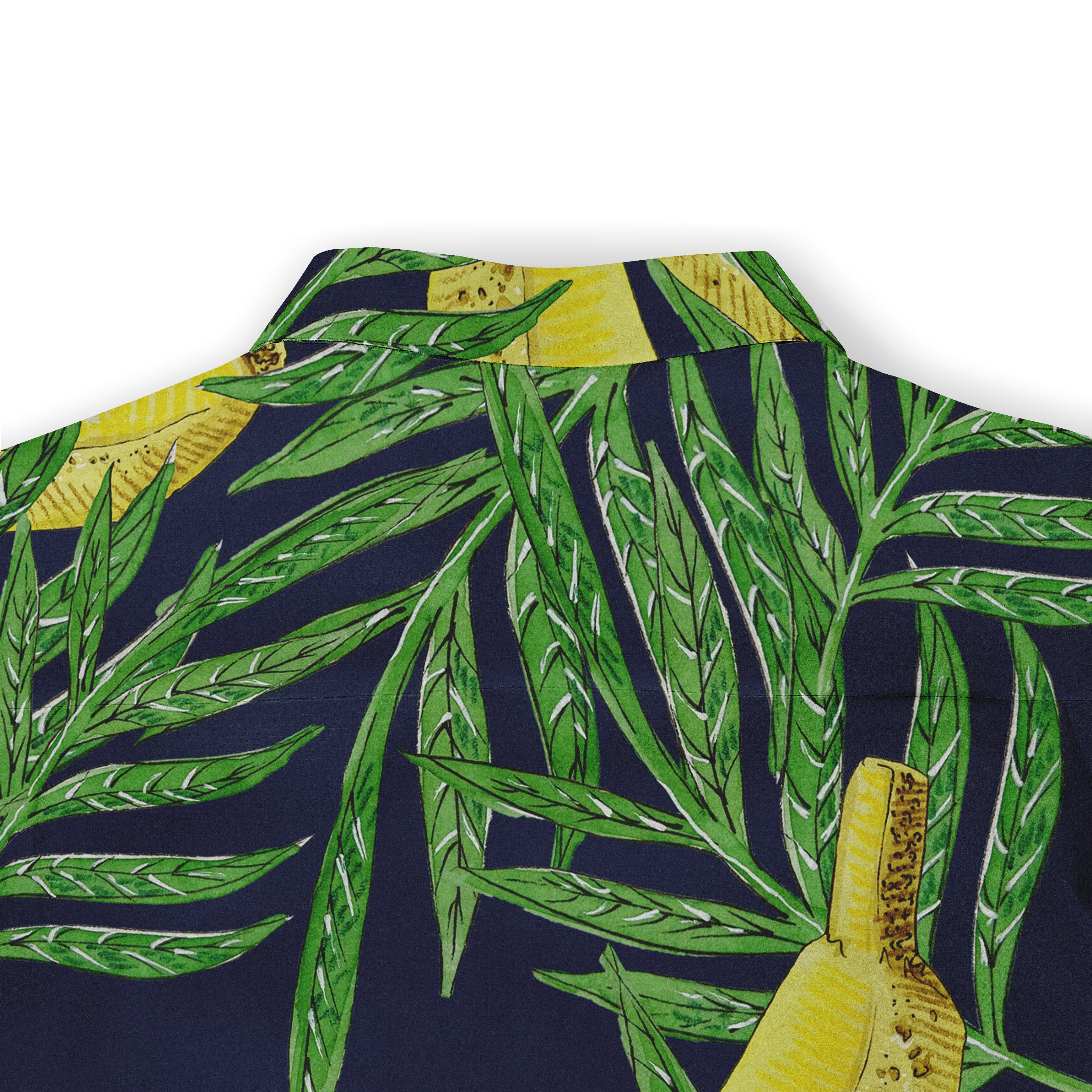 Tropical print shirt with banana and palm leaves on navy background.