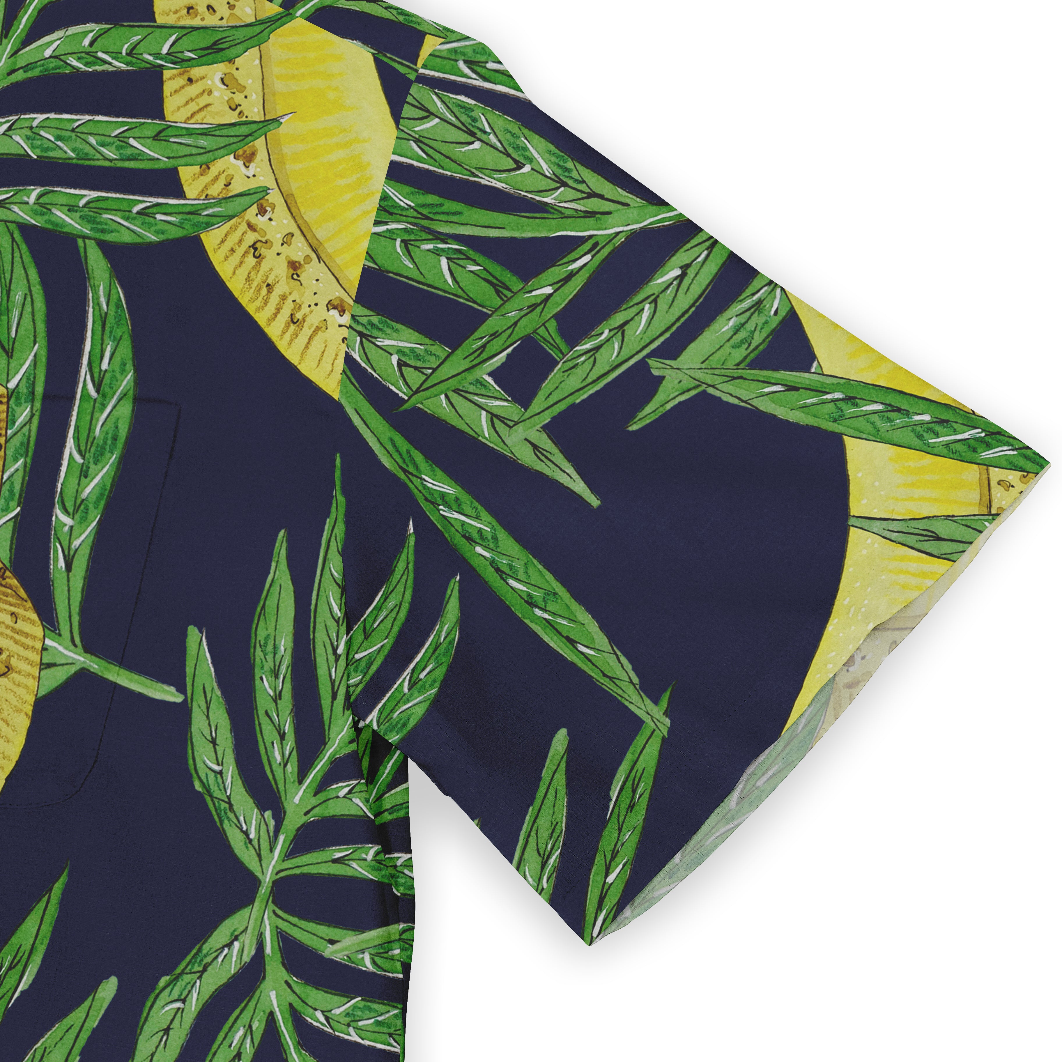 Navy blue fabric with vibrant green palm leaves and yellow citrus.