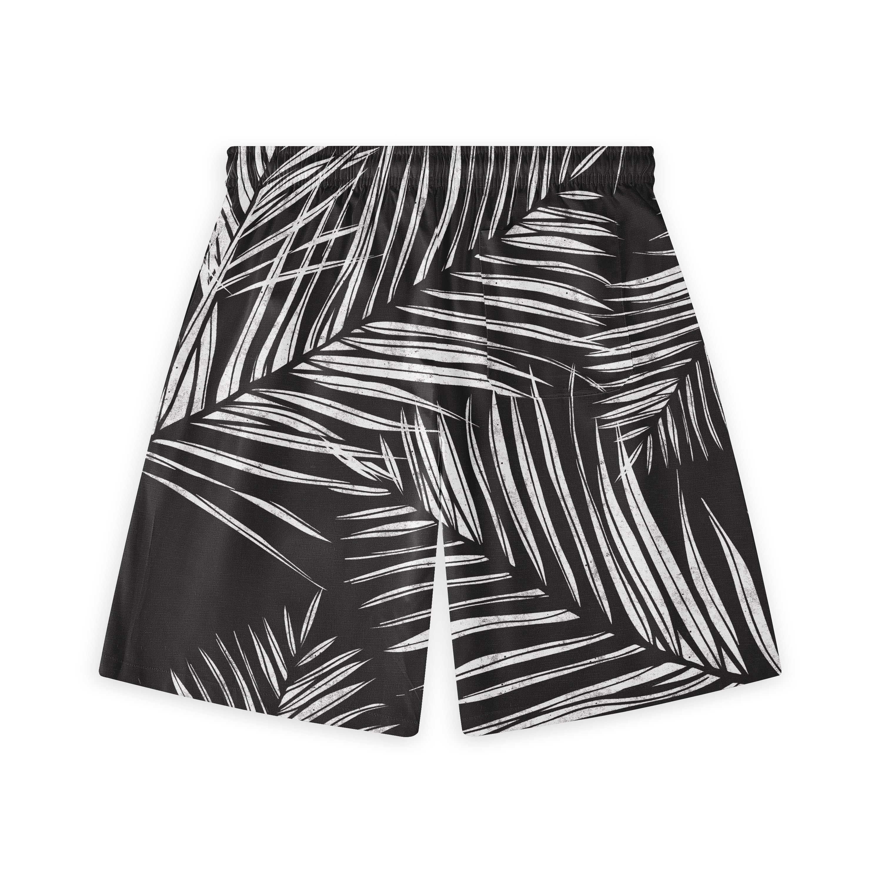 Black shorts with white palm leaf print, elastic waistband, relaxed.