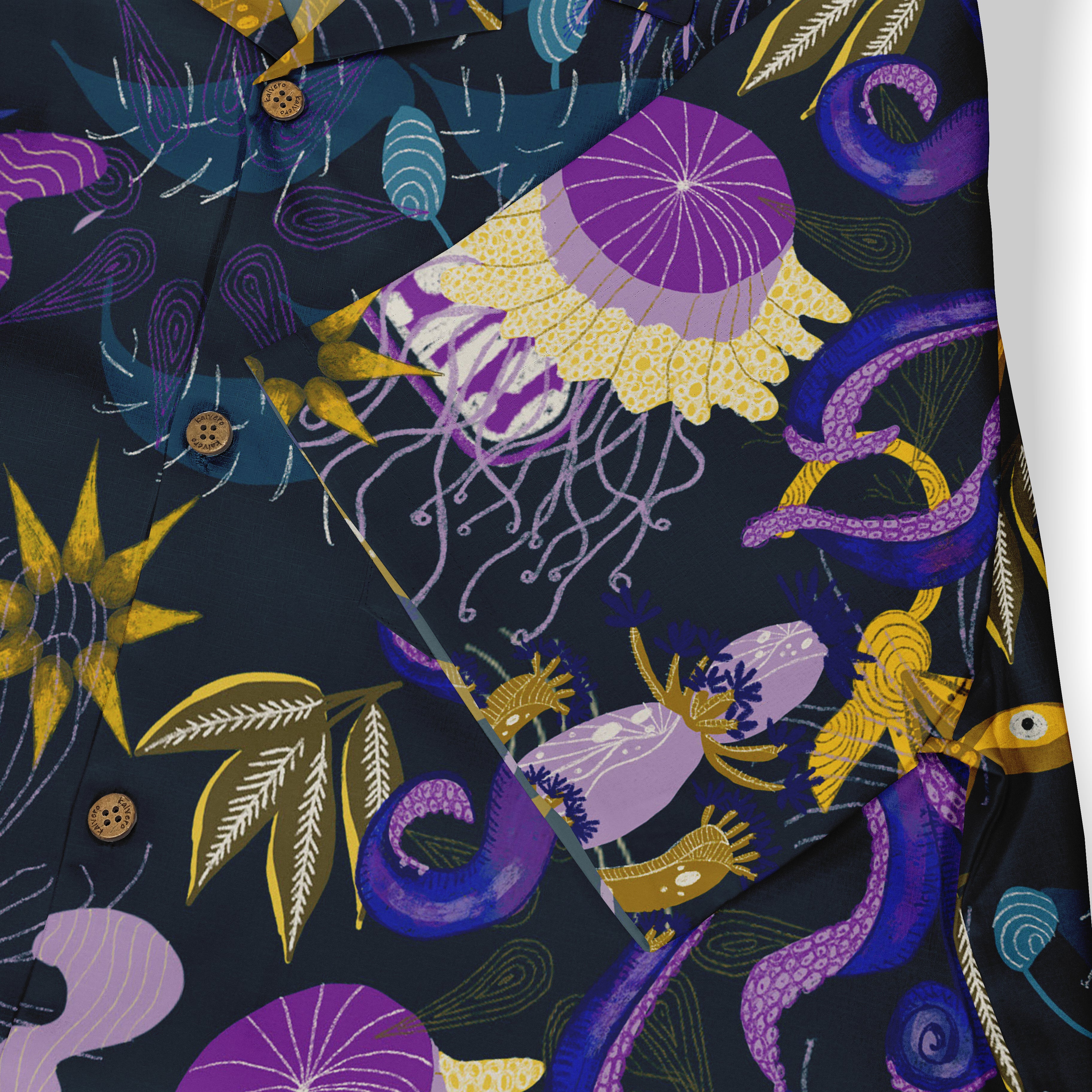 Dark shirt with vibrant purple, yellow, and blue abstract patterns.