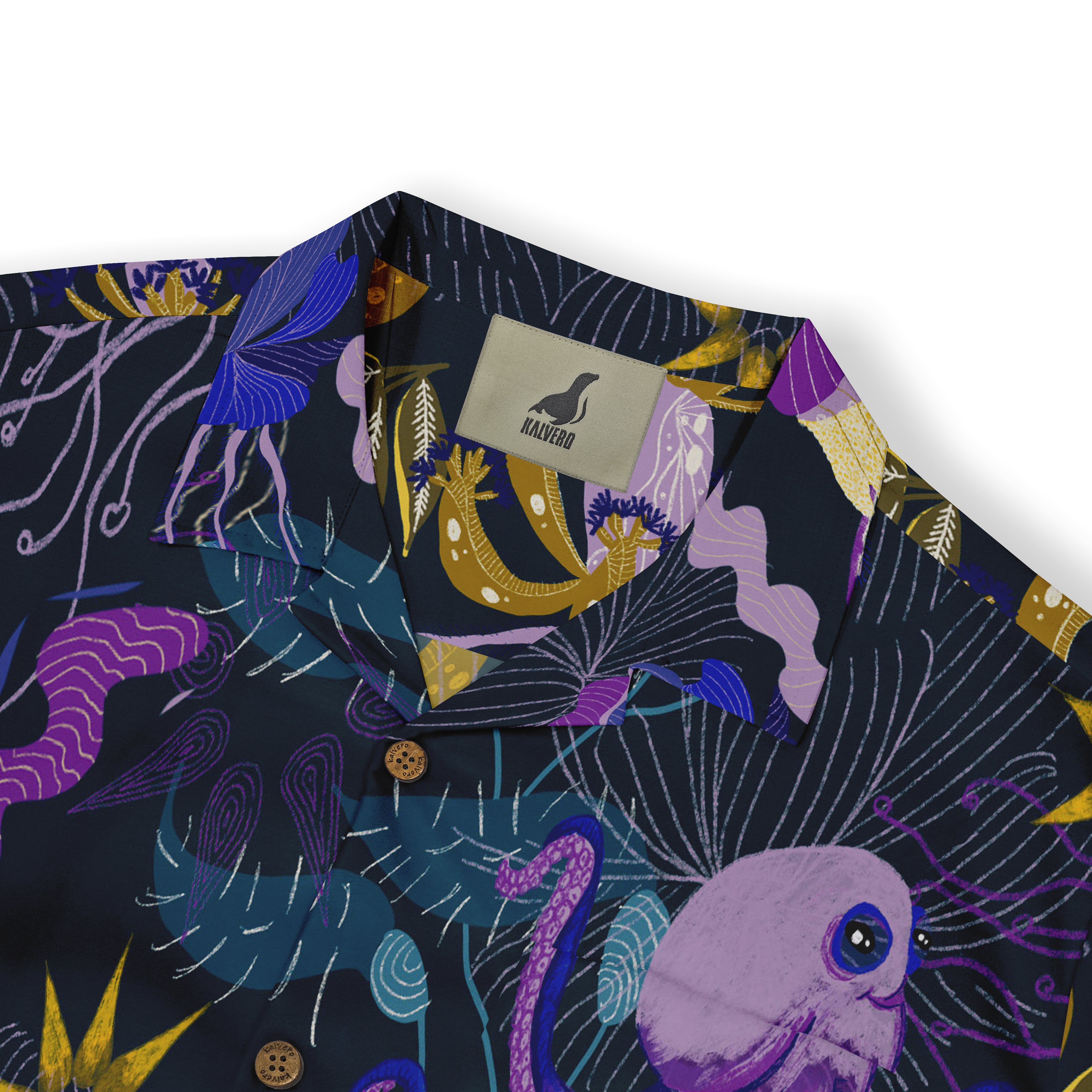 Vibrant navy shirt with colorful sea creature print, featuring.