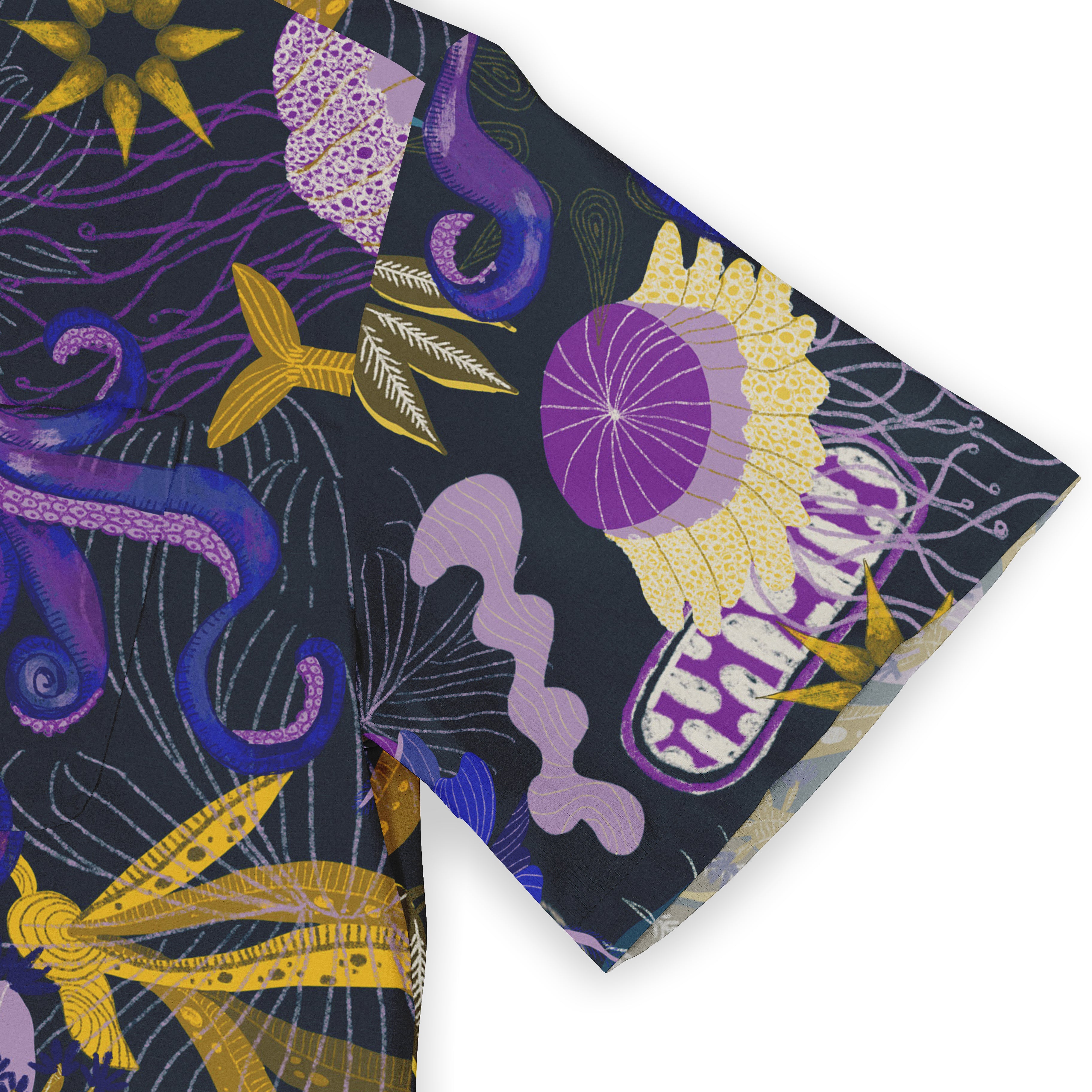Dark fabric with purple, yellow, and blue abstract patterns.