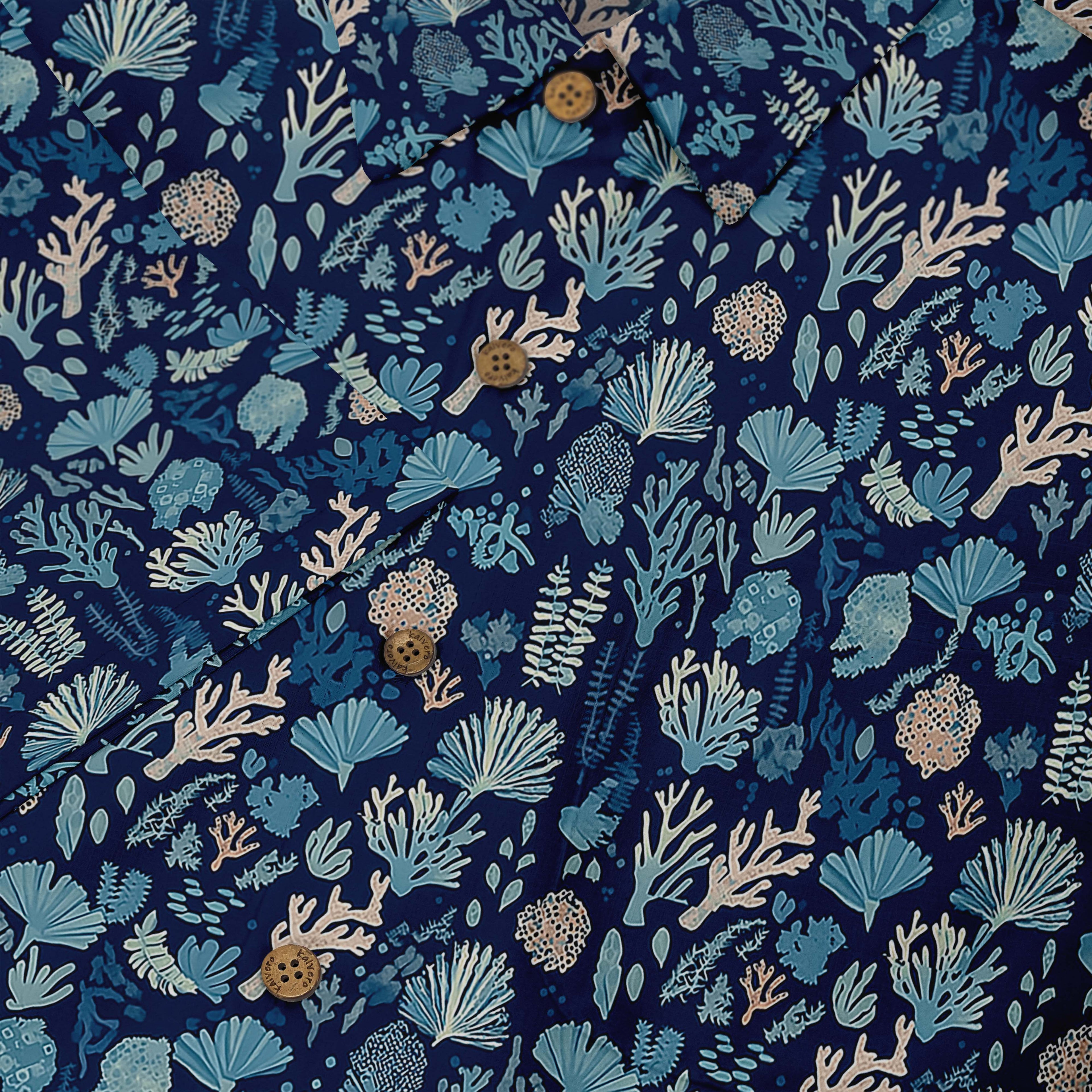 Blue shirt with coral and seaweed print, button-up design.