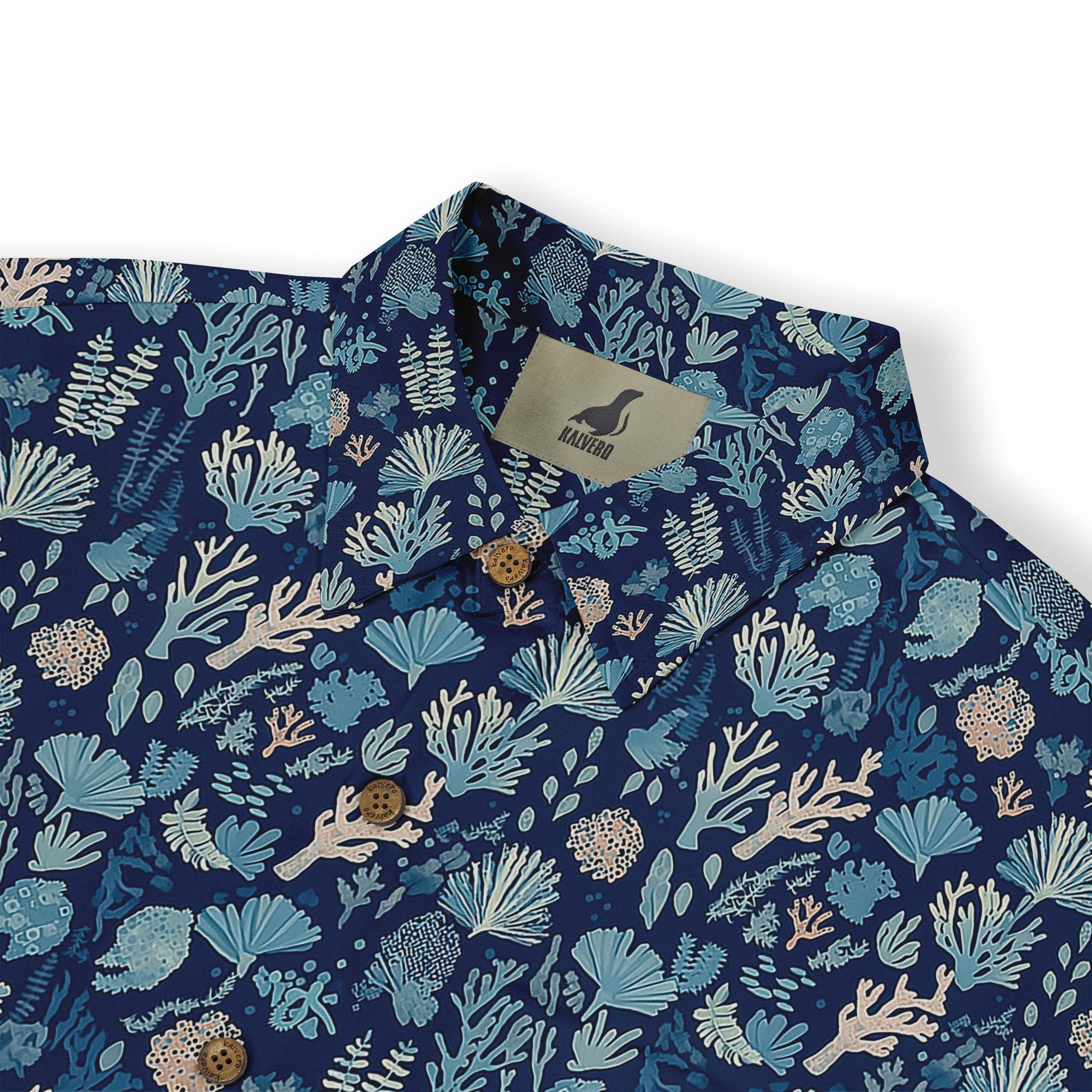 Blue shirt with coral and sea life print, button-up design.