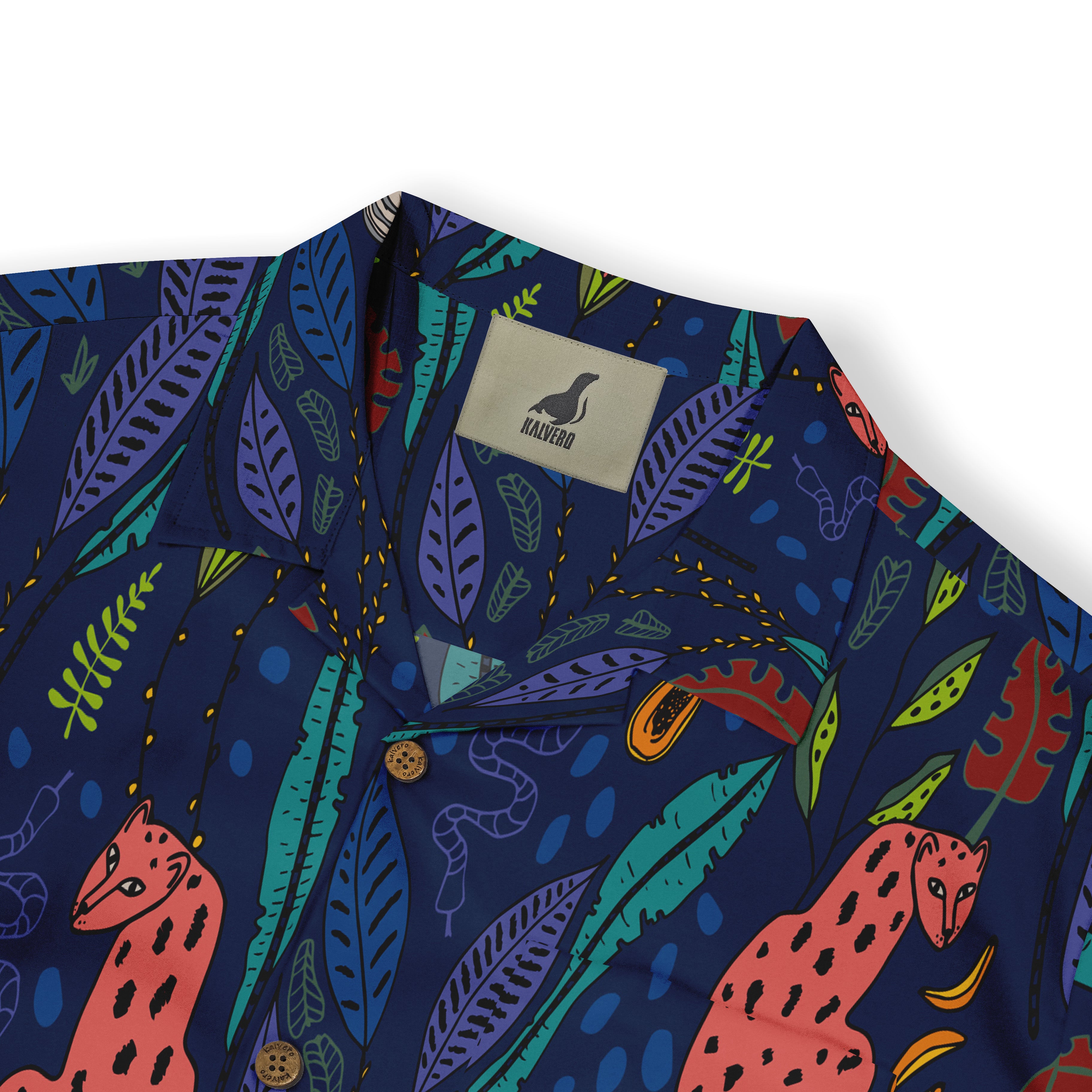 Vibrant navy shirt with tropical leaves, red jaguars, and colorful.