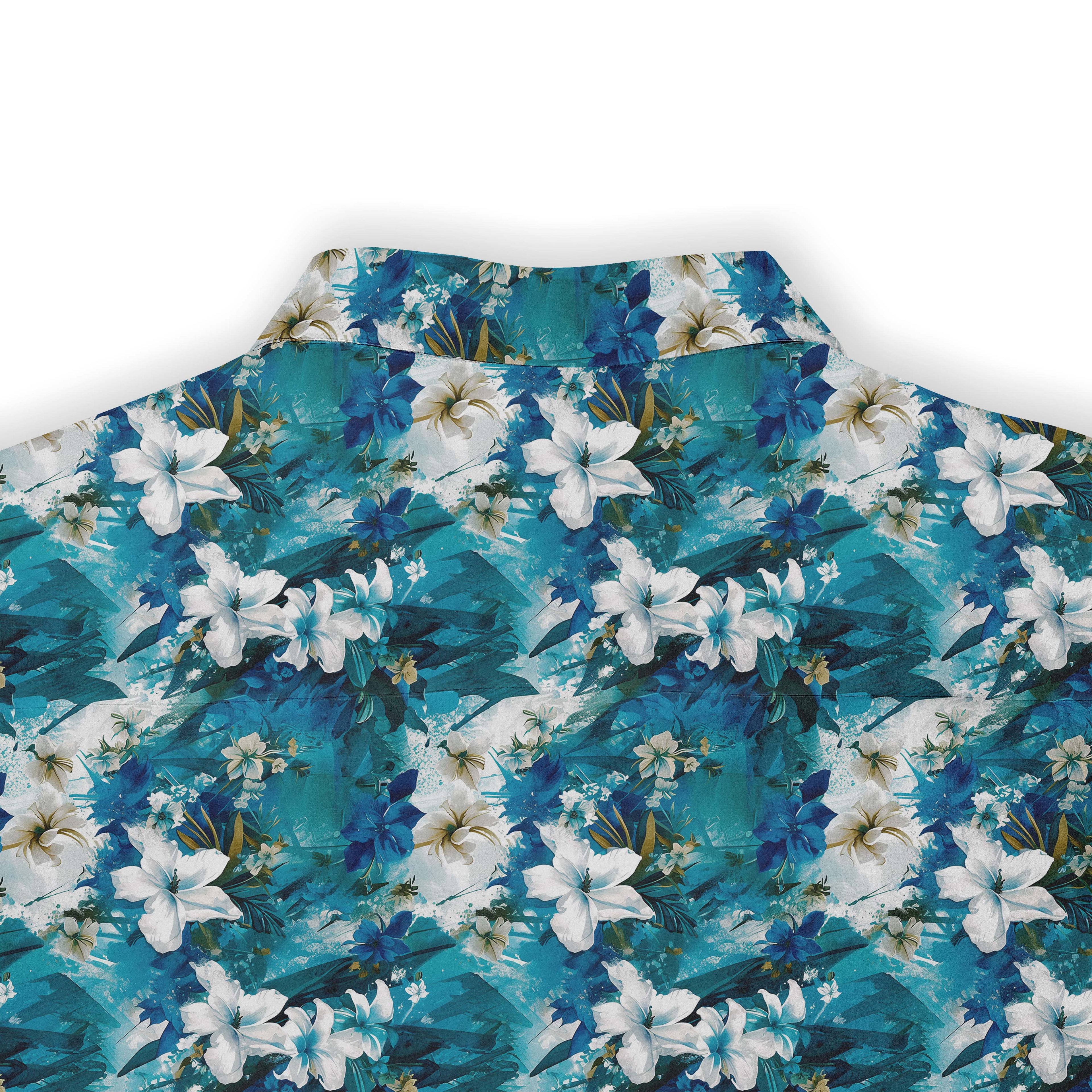 Blue floral shirt with white flowers and green leaves.