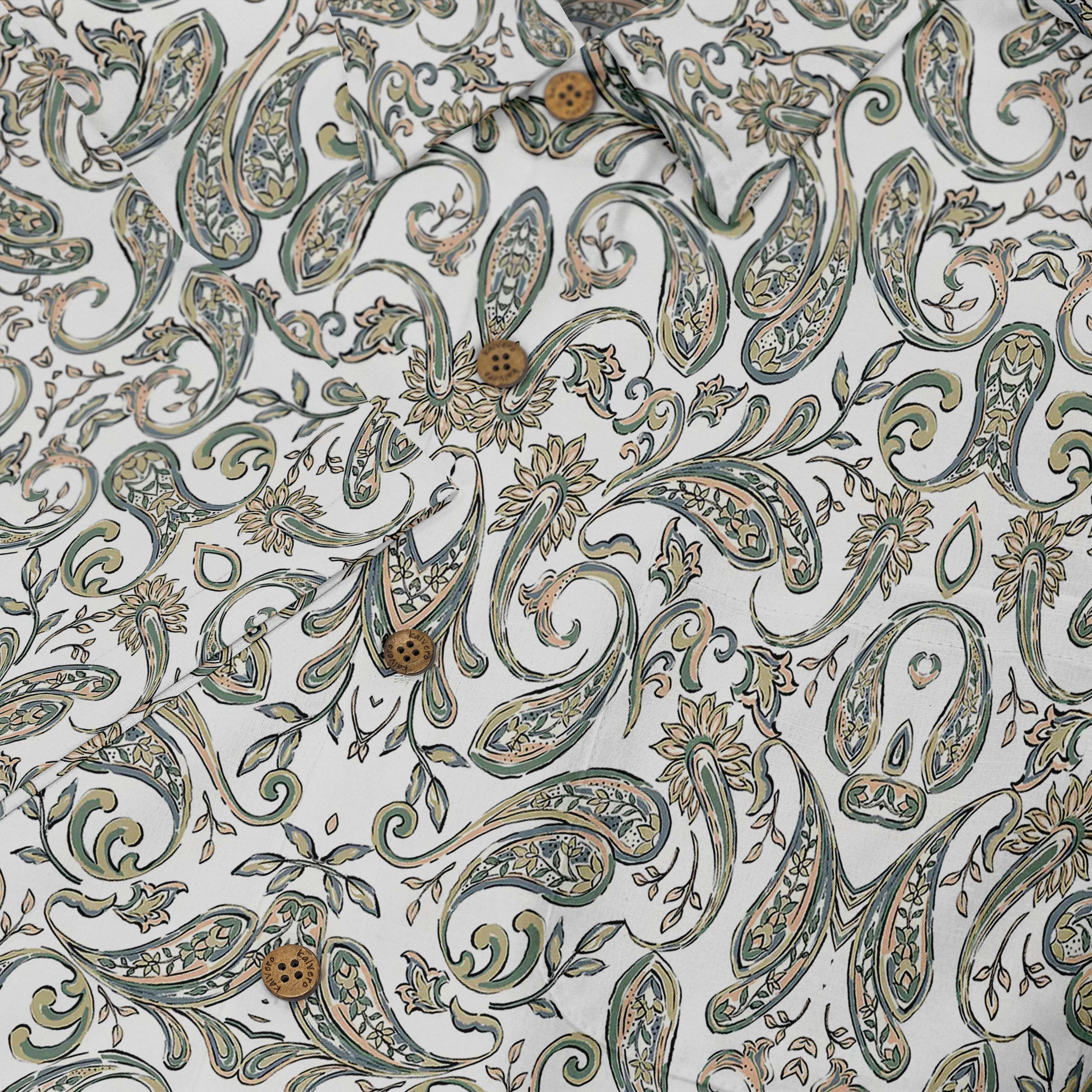 White fabric with green, gold paisley pattern and buttons.