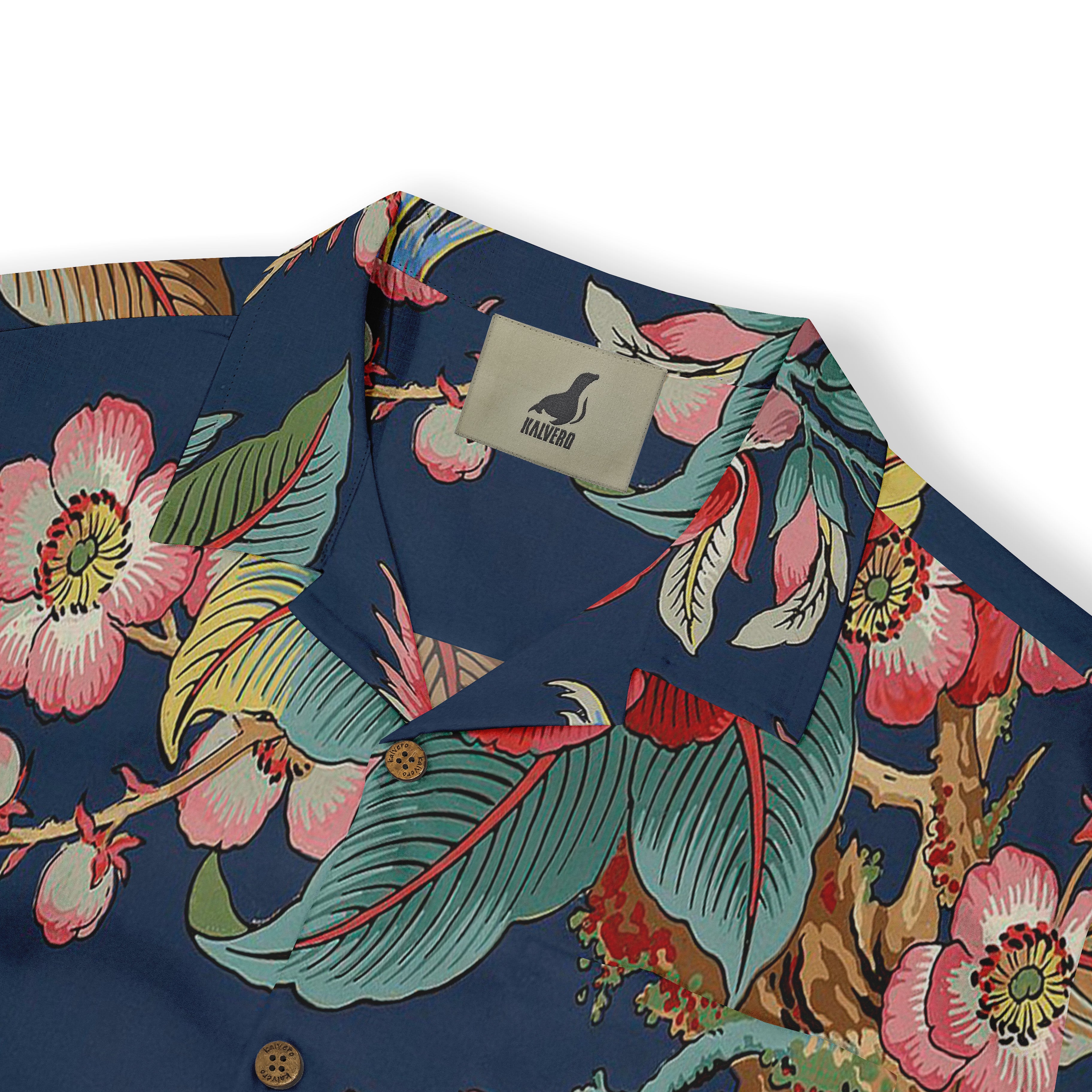 Blue floral shirt with pink flowers and green leaves.