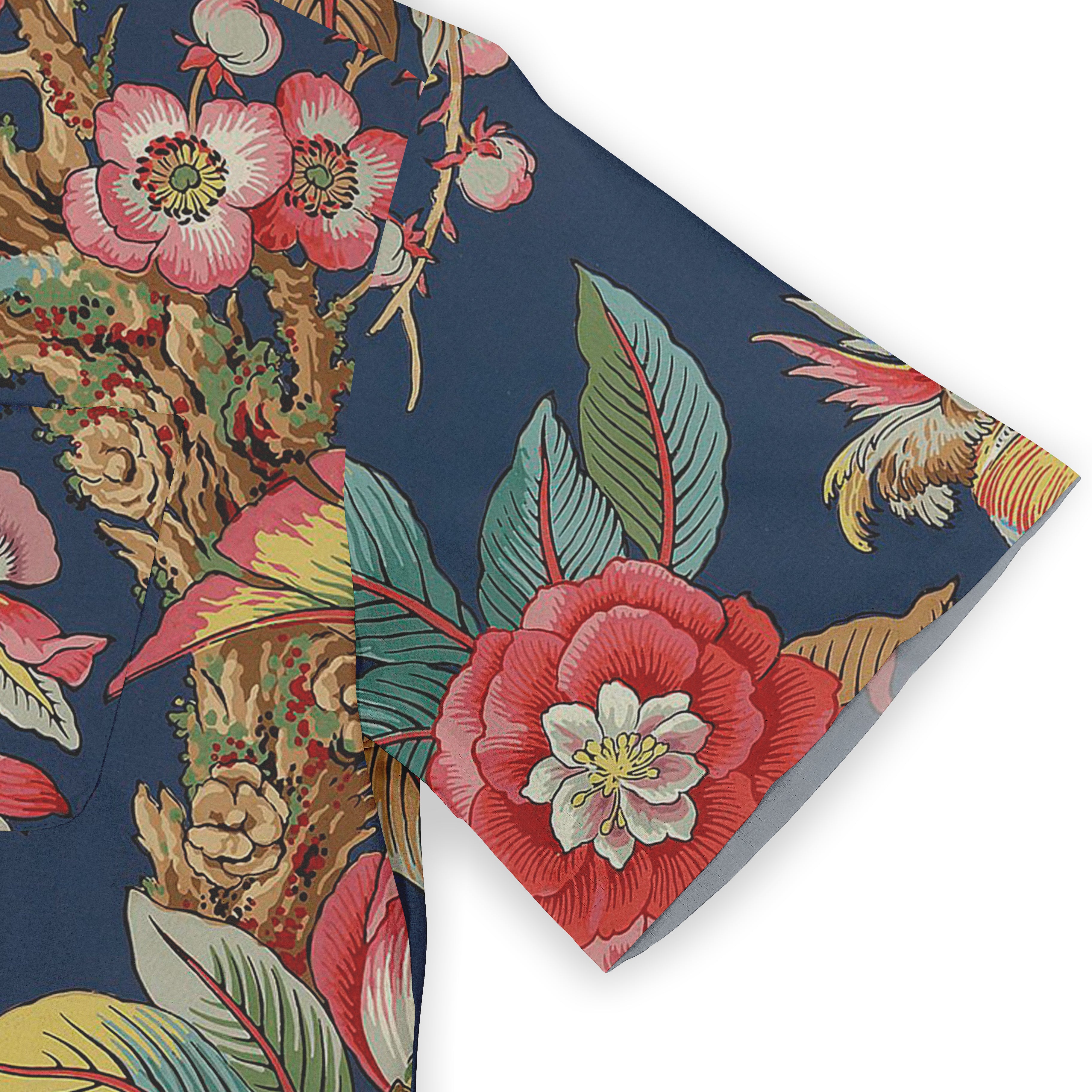 Vibrant floral pattern on navy blue fabric, featuring bold red.