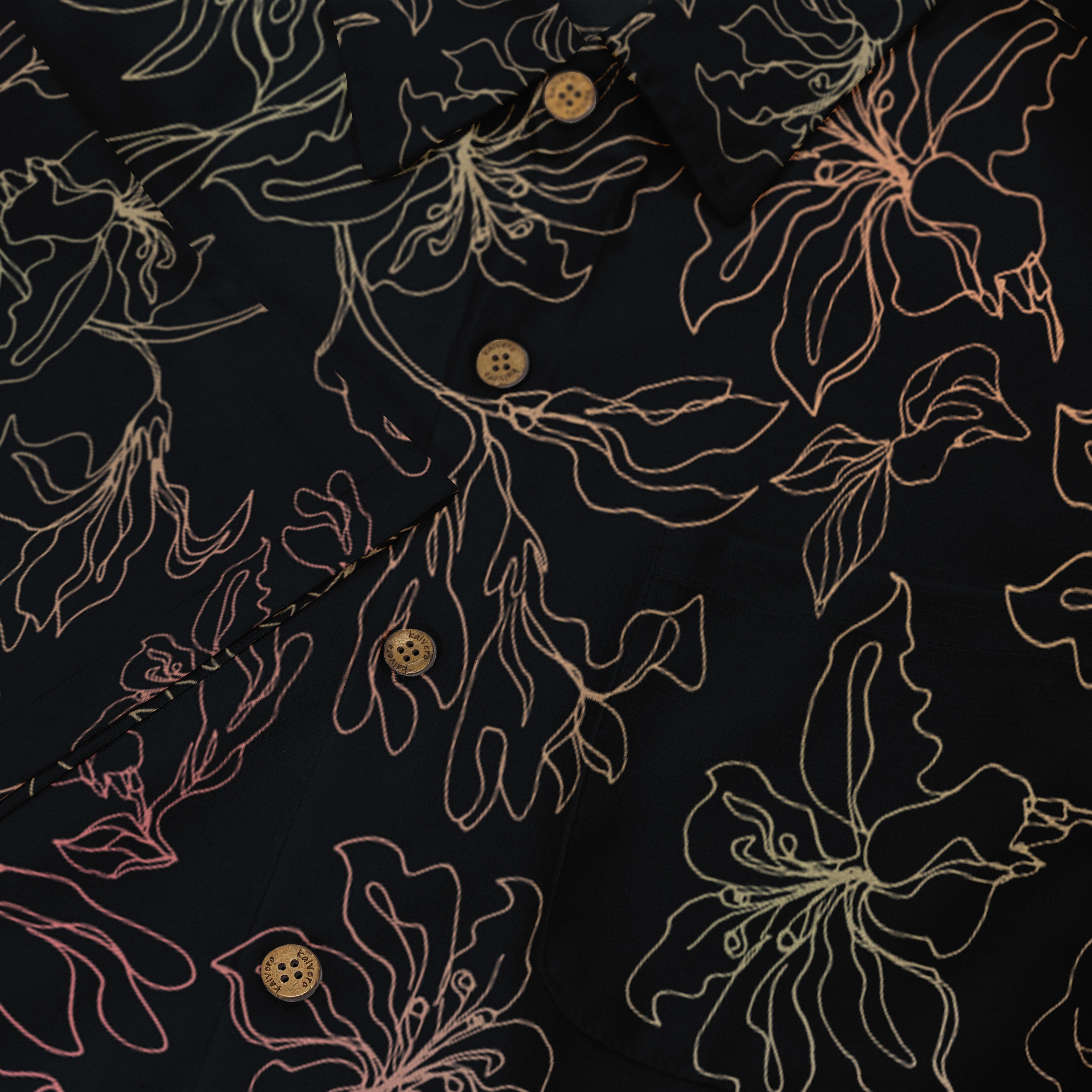 Black shirt with gold floral outline pattern and buttons.
