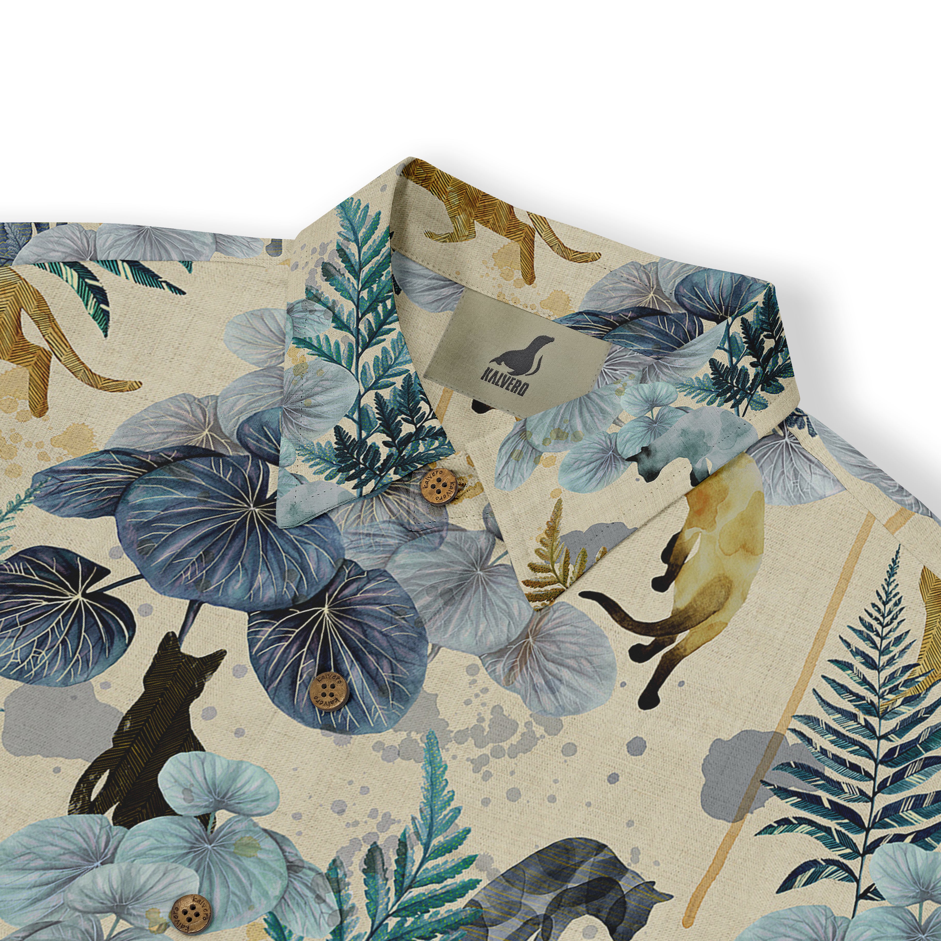 Beige shirt with blue leaves, brown animals, and wooden buttons.