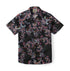 Black shirt with red, blue, and white paisley pattern.
