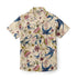 Cream short-sleeve shirt with blue birds, pink flowers, and green.