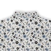 White fabric with black and blue floral pattern.