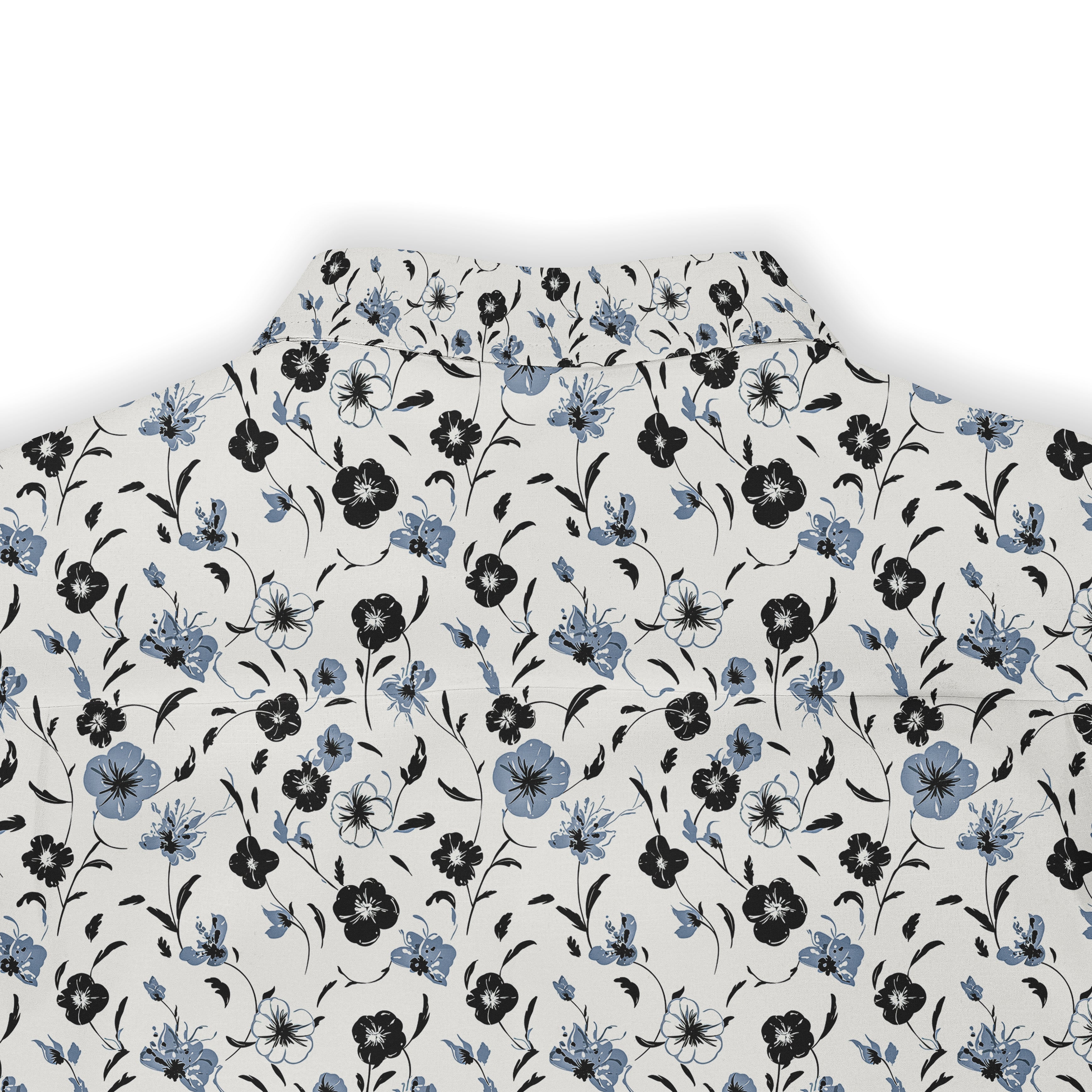 White fabric with black and blue floral pattern.