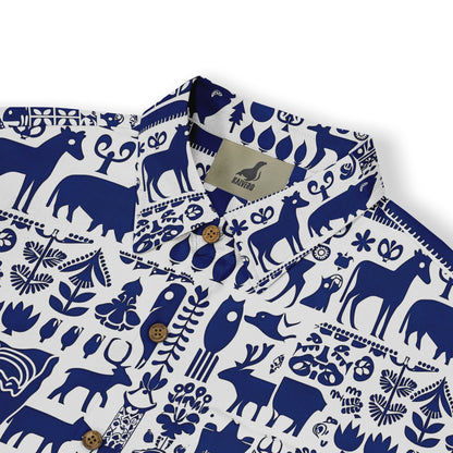 White shirt with blue animal and nature pattern, featuring wooden.