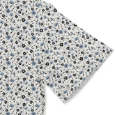 Gray fabric with blue and black floral pattern.