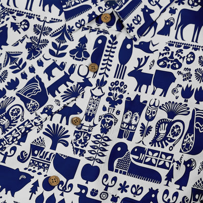 Blue and white patterned fabric with animals and plants.
