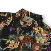 Black shirt with vibrant tropical print featuring leopards, flowers.
