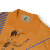 Orange polo shirt with blue stripes, tennis player graphic.