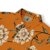 Orange floral shirt with beige flowers, green leaves, and brown.