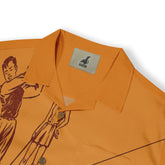 Orange shirt with graphic print and Malvero brand label on collar.